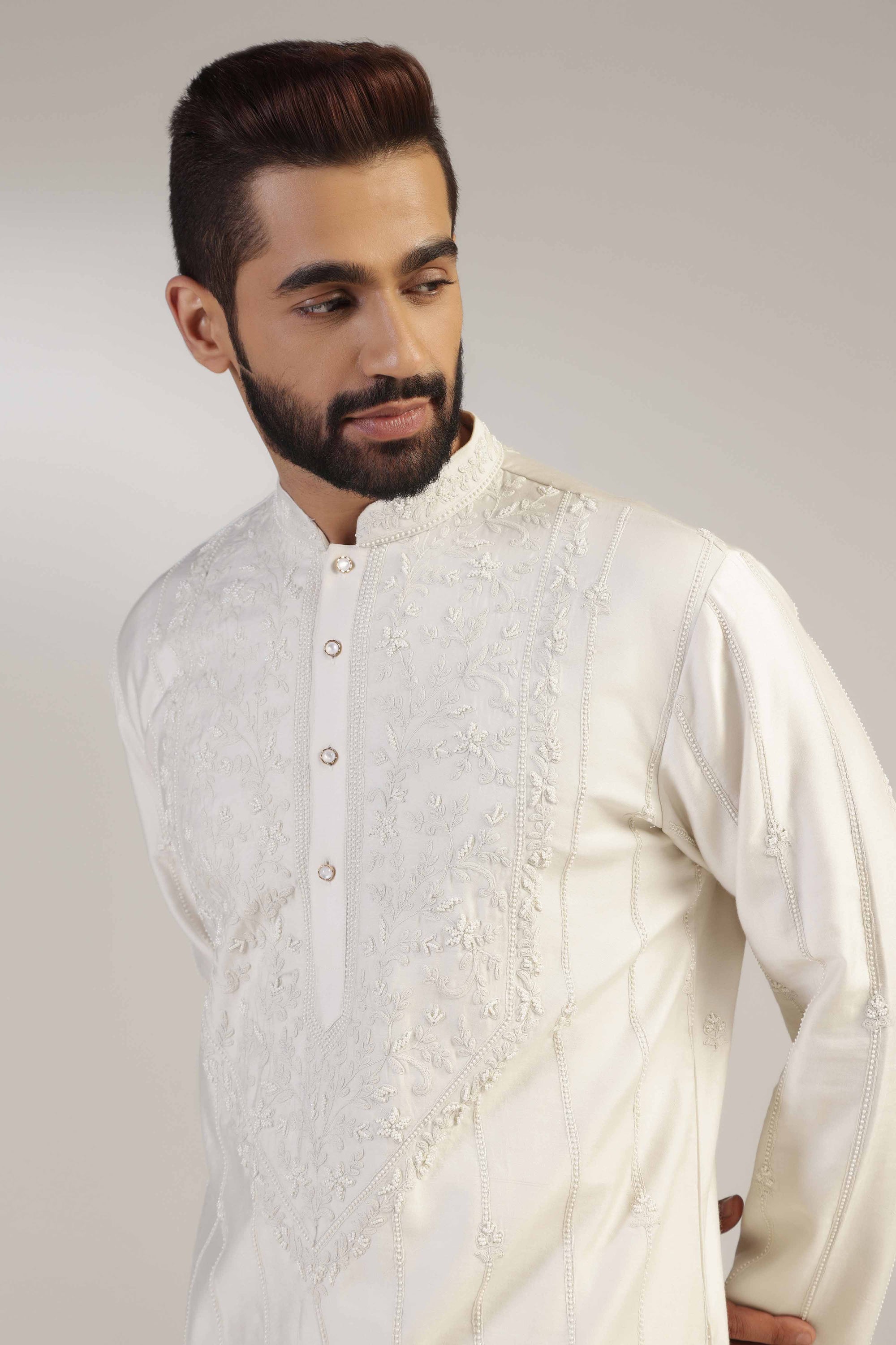 Crafted in chanderi silk, this Embroidered Kurta Set exudes elegance and sophistication. Shop Now!