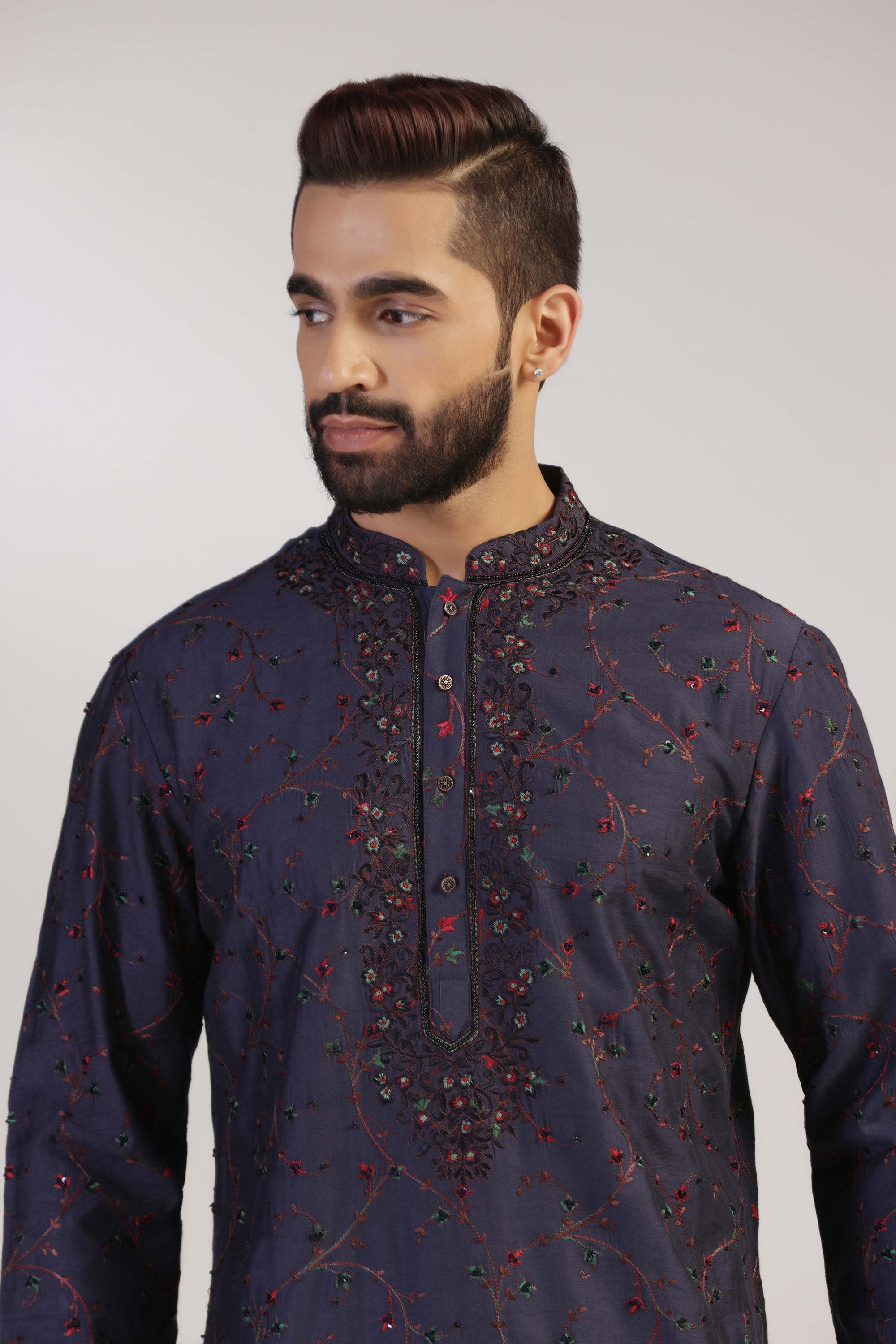 Crafted from fabric, this Navy Embroidered Kurta Set is the epitome of sophistication. Shop Now!