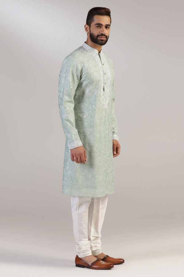 Crafted in luxurious silk fabric, this green Kurta pajama set is perfect for any occasion. Shop Now!