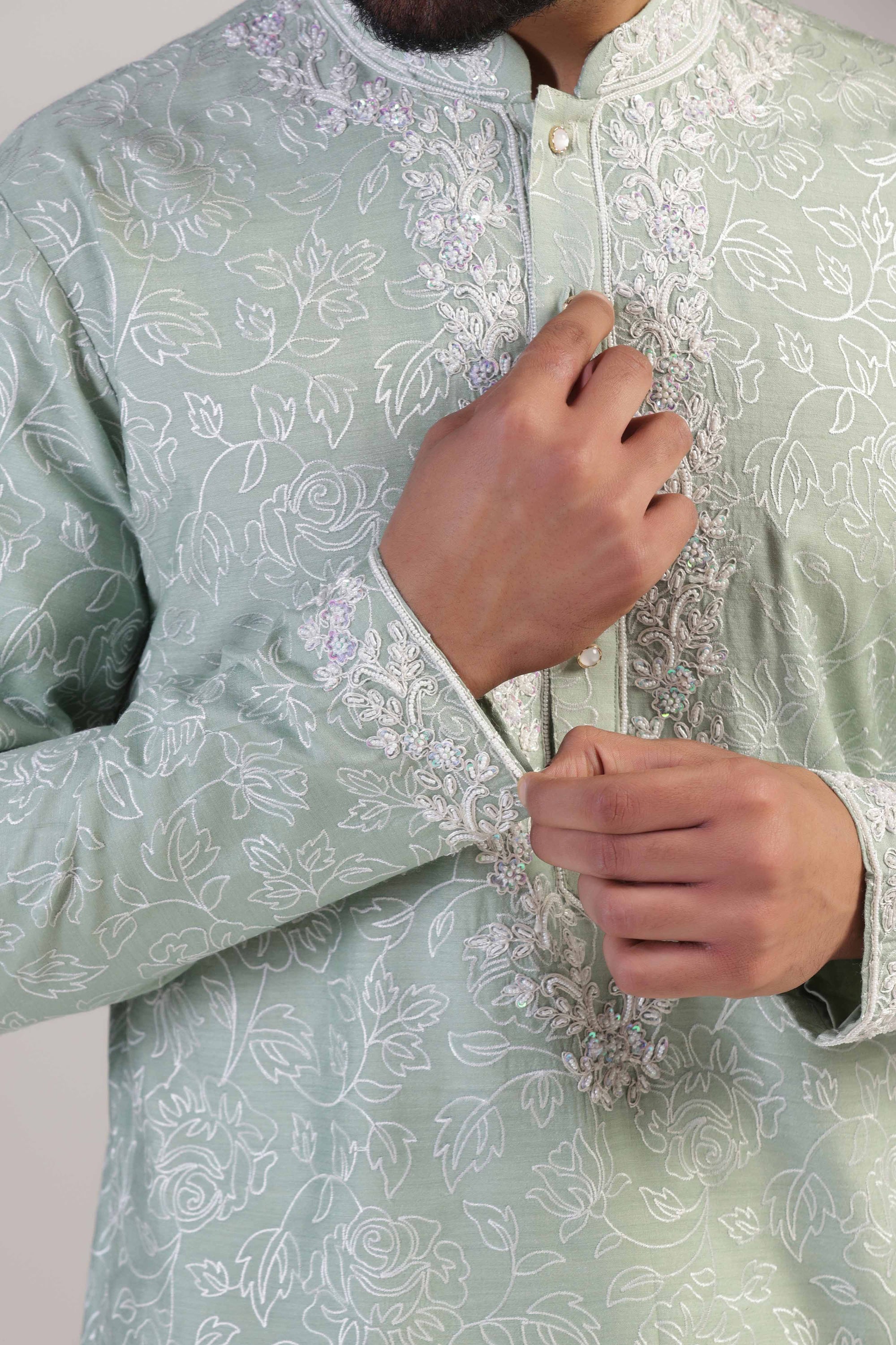 Crafted in luxurious silk fabric, this green Kurta pajama set is perfect for any occasion. Shop Now!
