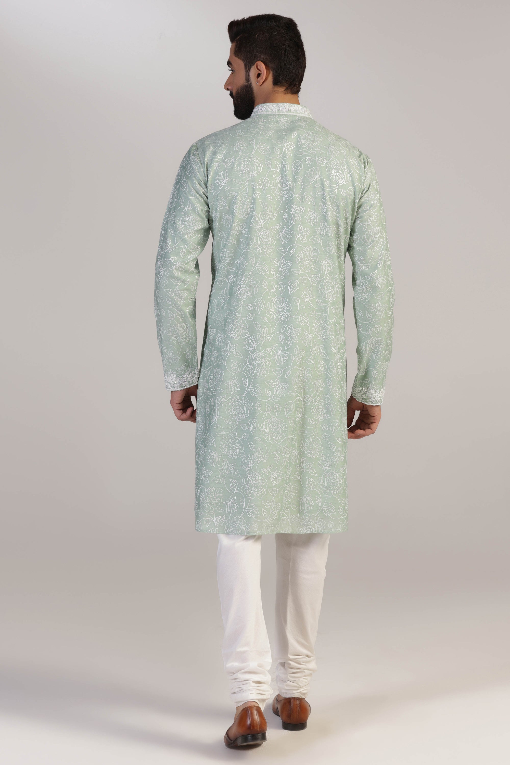Crafted in luxurious silk fabric, this green Kurta pajama set is perfect for any occasion. Shop Now!