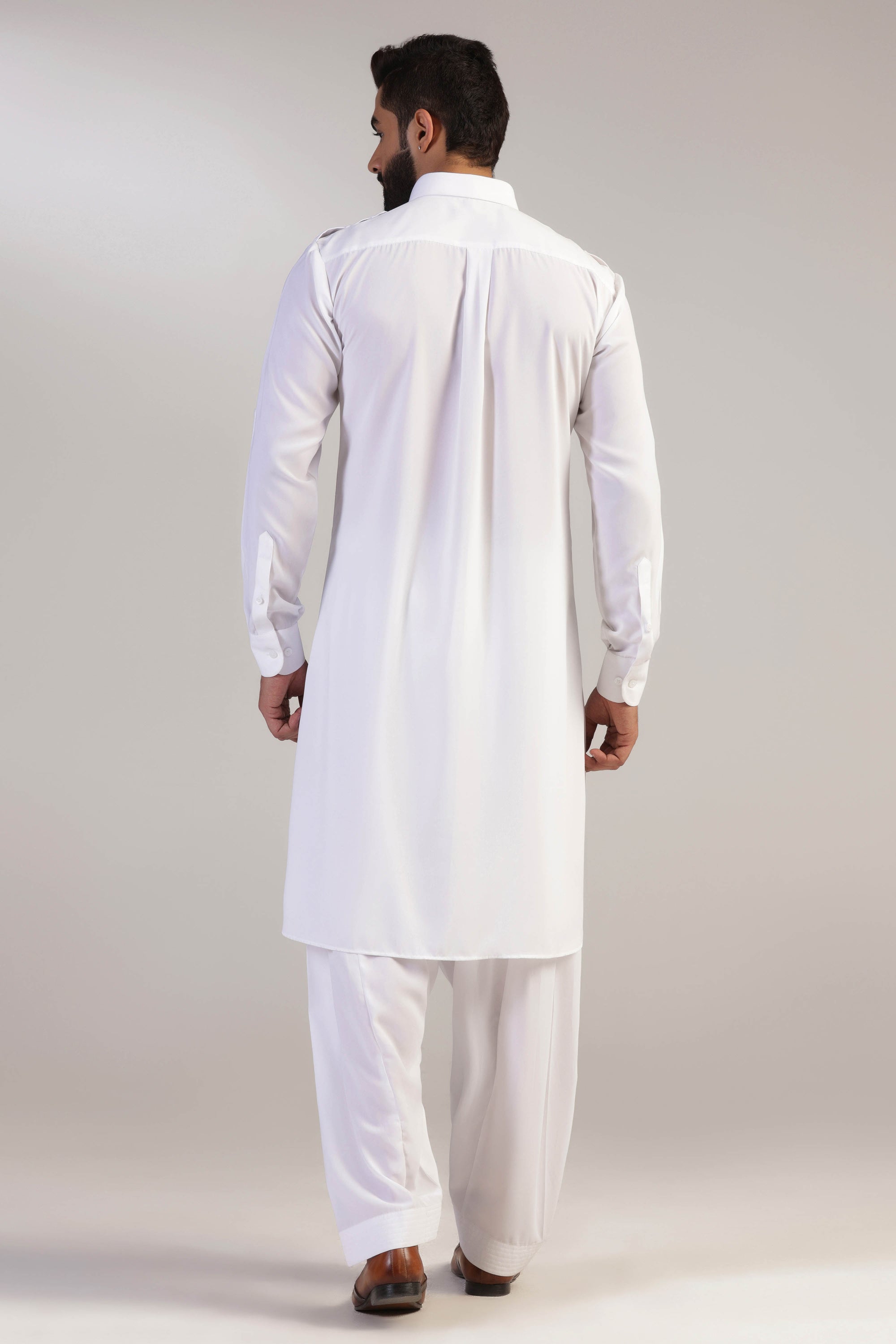 This traditional white pathani suit is made with micro fabric for a comfortable fit. Shop Now!
