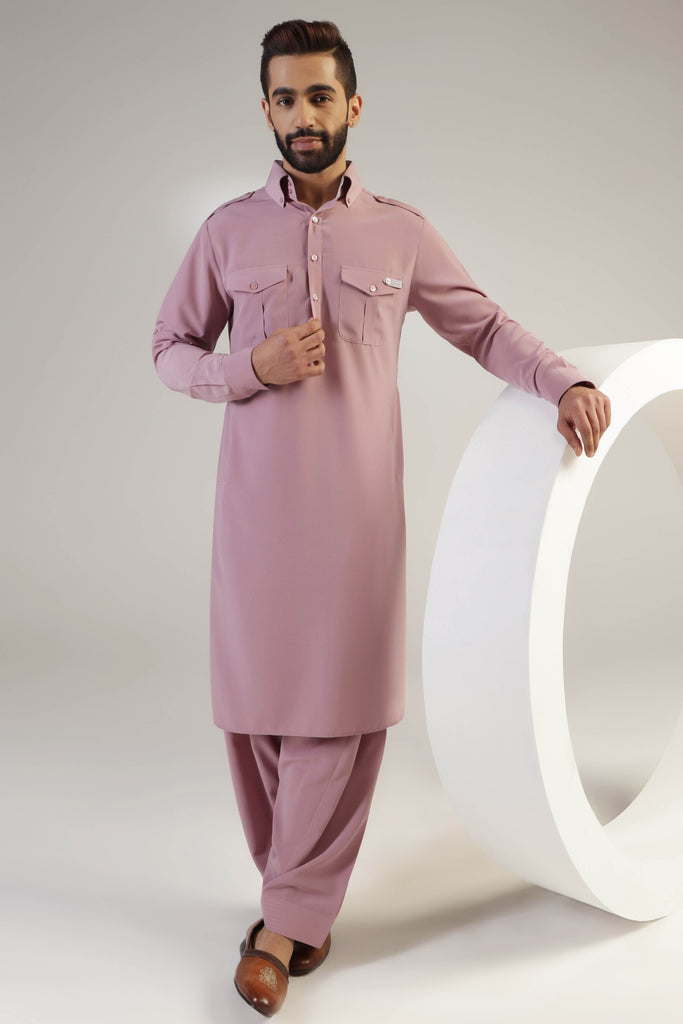 This Suit boasts traditional elements such as shoulder flaps, pleated chest pockets. Shop Now!