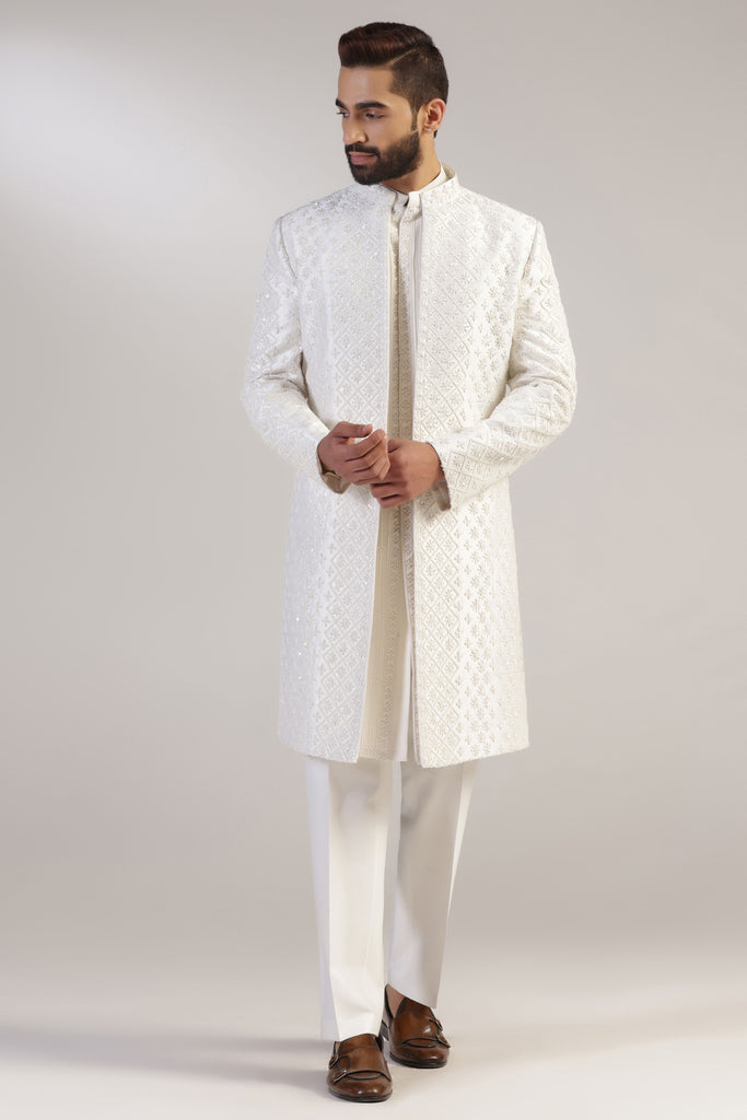 This Indowestern is from raw silk fabric, featuring tonal thread and bead embroidery. Shop Now!