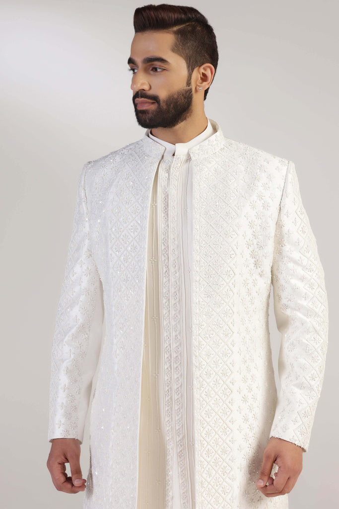 This Indowestern is from raw silk fabric, featuring tonal thread and bead embroidery. Shop Now!