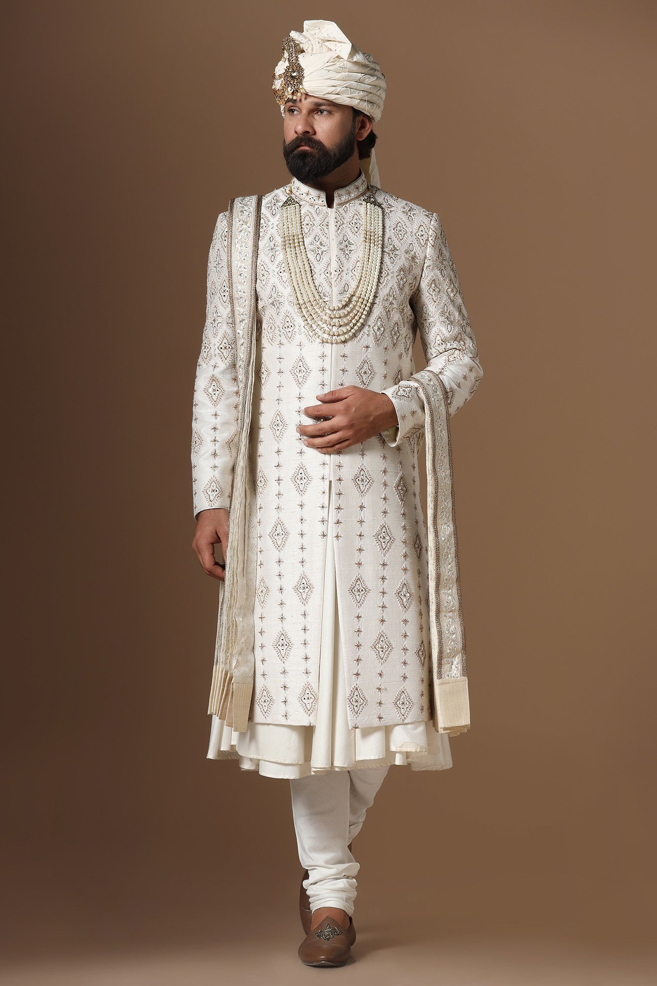 Elevate your style with this elegant Off- white Raw-Silk Sherwani. Shop Now!