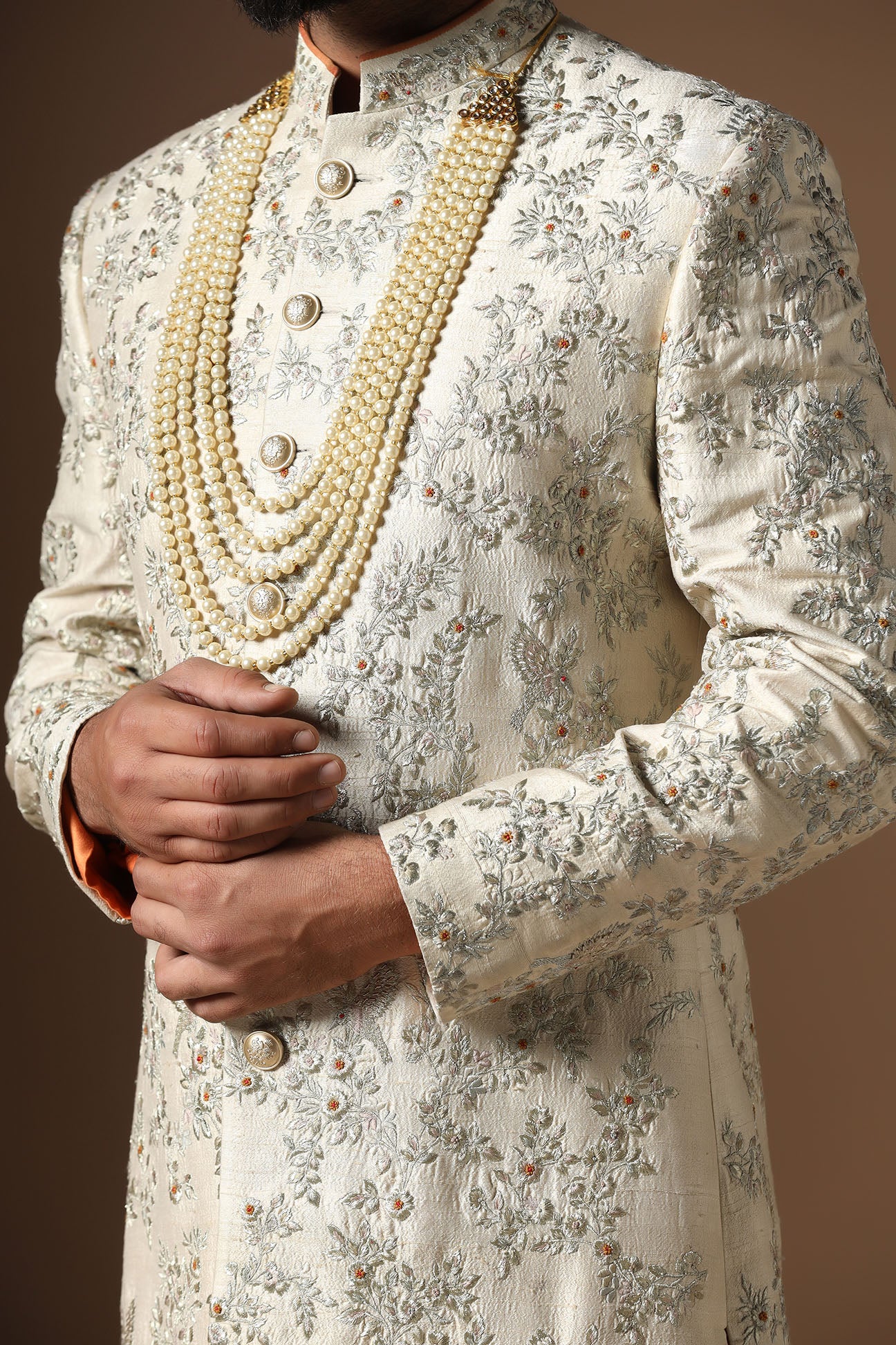 Embrace sophistication with our beige floral embroidered Sherwani. Shop Now!