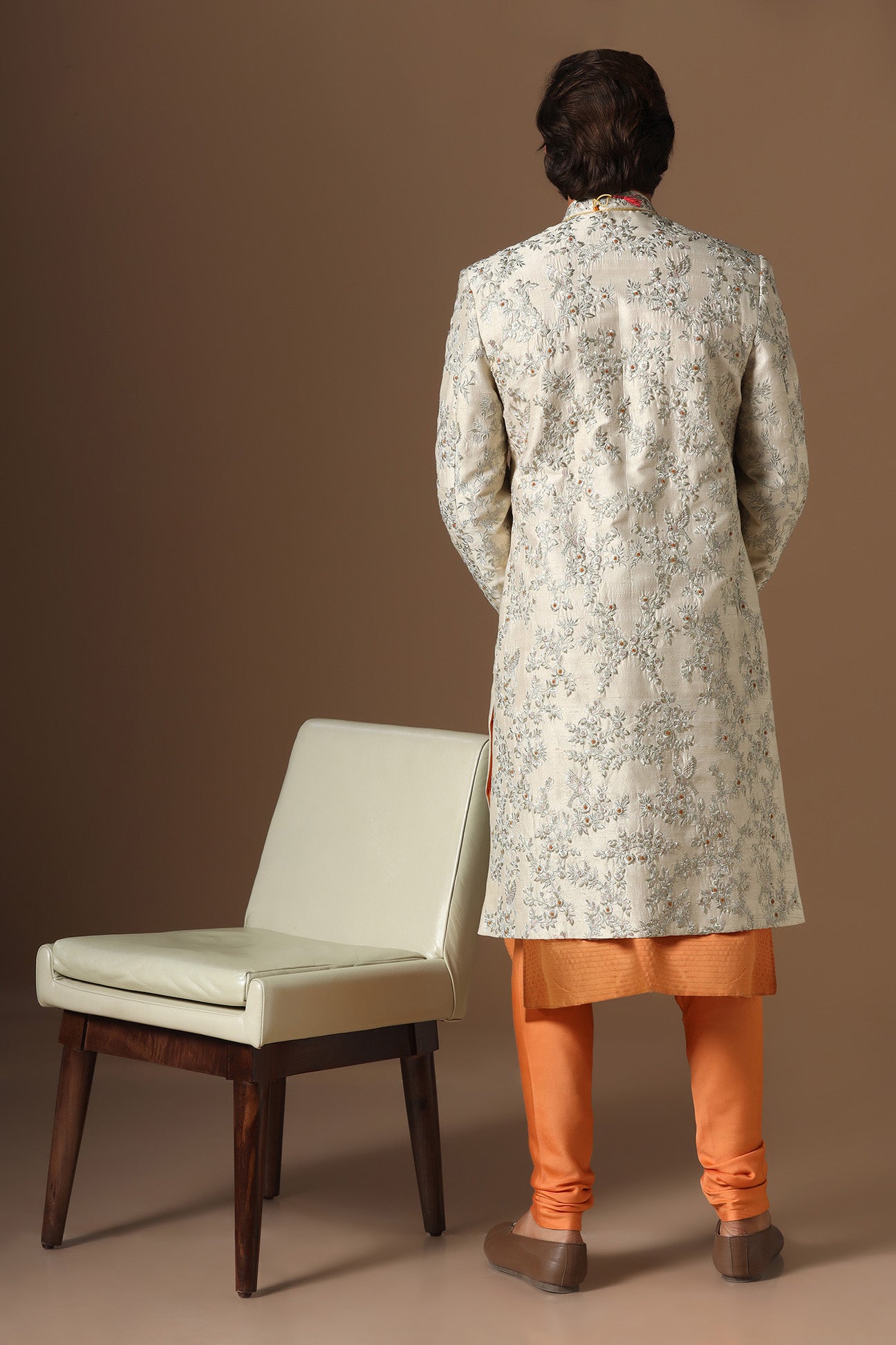 Embrace sophistication with our beige floral embroidered Sherwani. Shop Now!