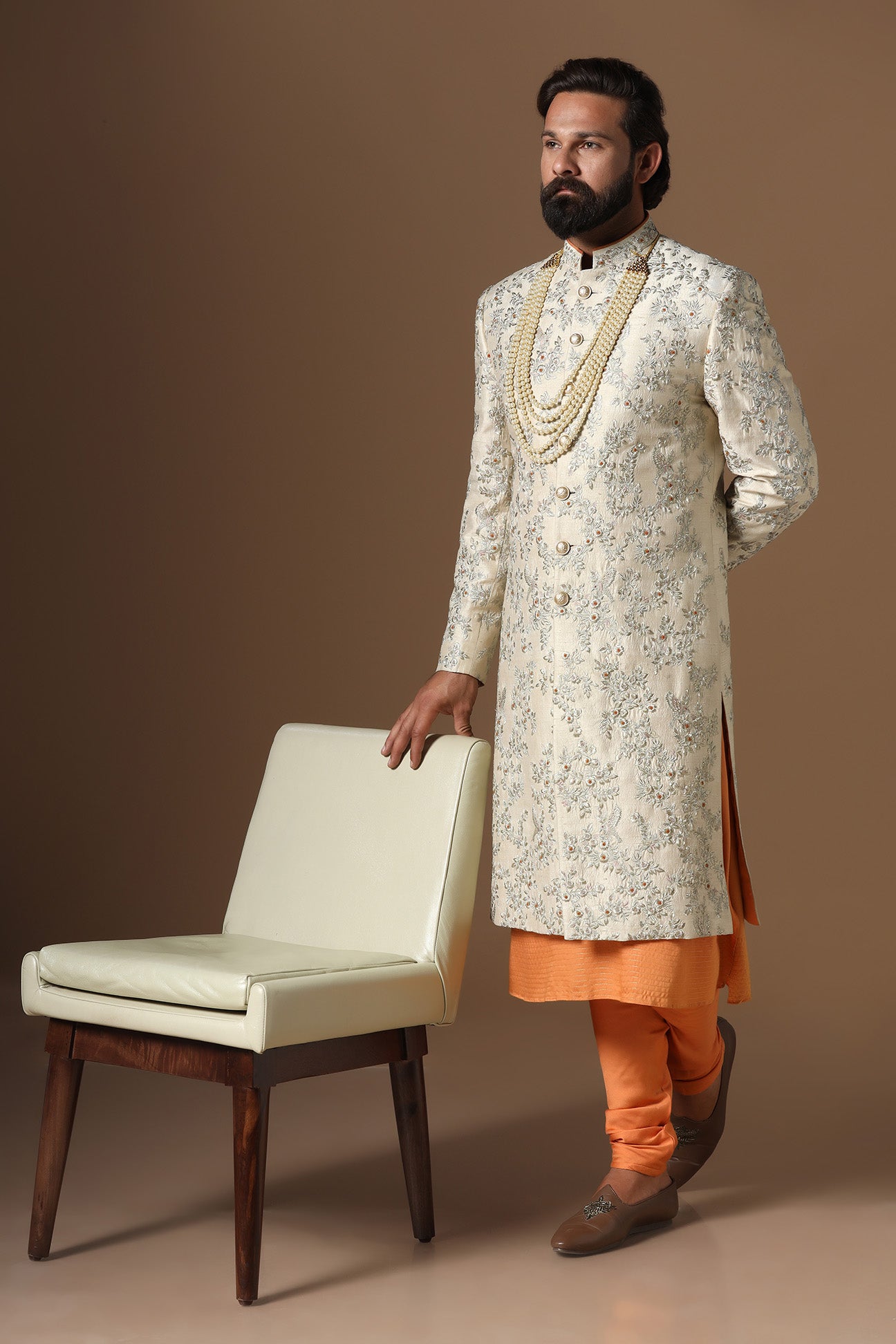 Embrace sophistication with our beige floral embroidered Sherwani. Shop Now!