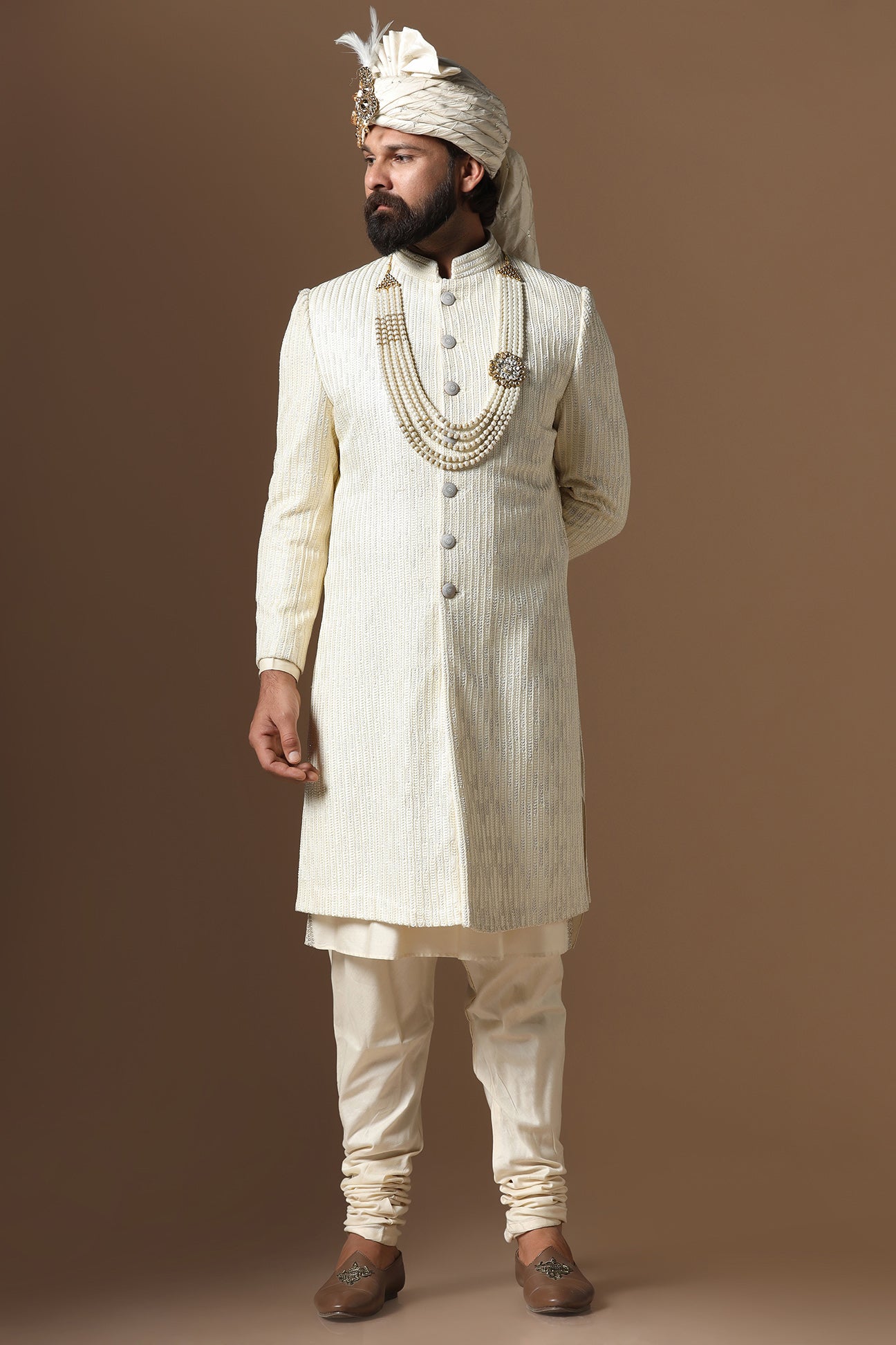 Distinguished by exquisite tonal threadwork, this Off-White Sherwani exudes elegance. Shop Now!