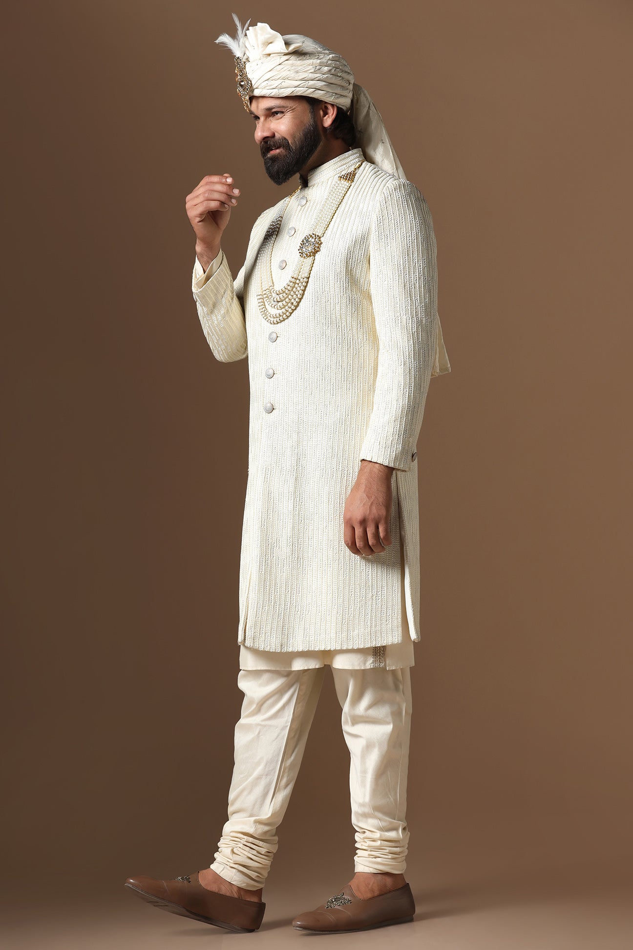 Distinguished by exquisite tonal threadwork, this Off-White Sherwani exudes elegance. Shop Now!