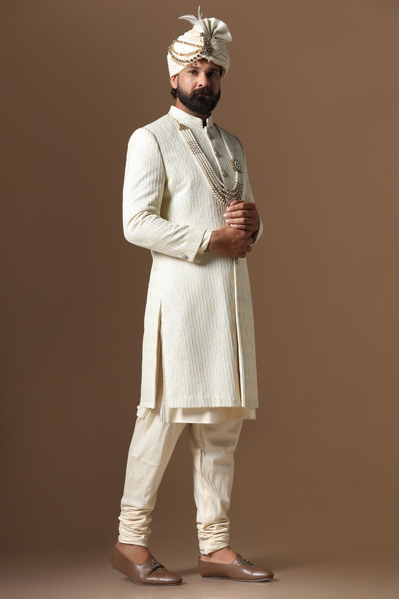 Distinguished by exquisite tonal threadwork, this Off-White Sherwani exudes elegance. Shop Now!