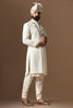 Distinguished by exquisite tonal threadwork, this Off-White Sherwani exudes elegance. Complete with kurta and pajama set for a refined ensemble.