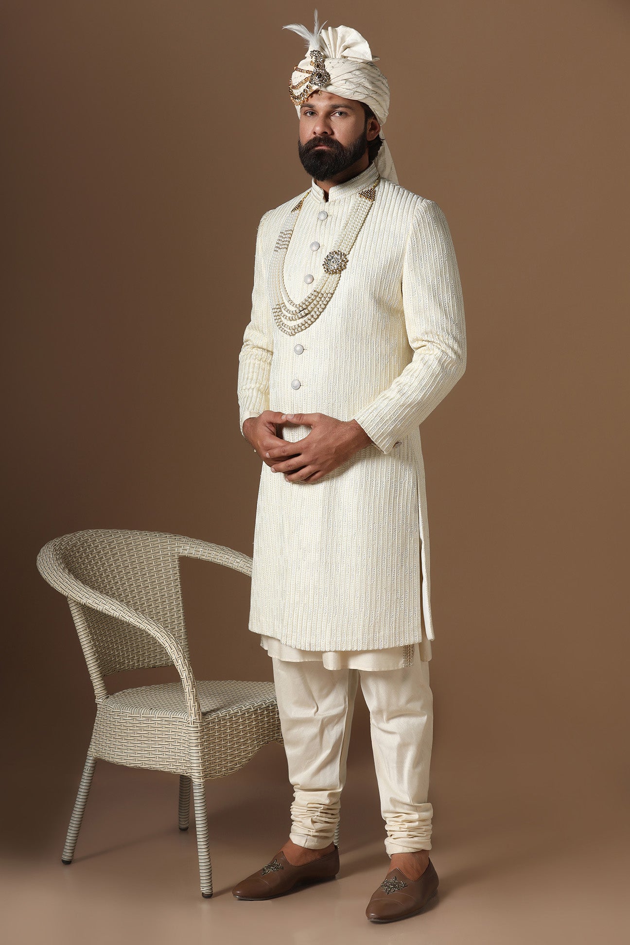Distinguished by exquisite tonal threadwork, this Off-White Sherwani exudes elegance. Shop Now!