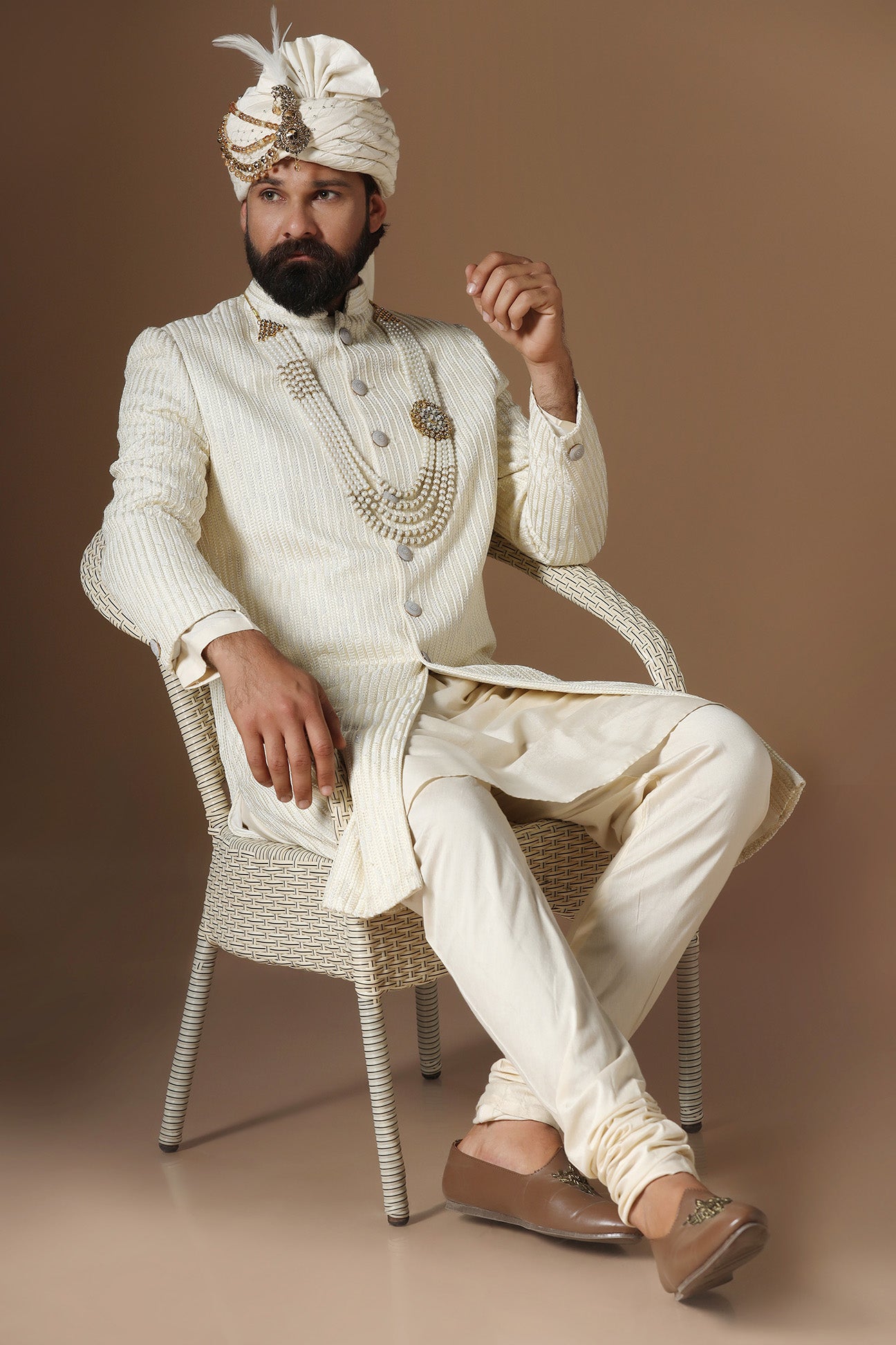 Distinguished by exquisite tonal threadwork, this Off-White Sherwani exudes elegance. Shop Now!