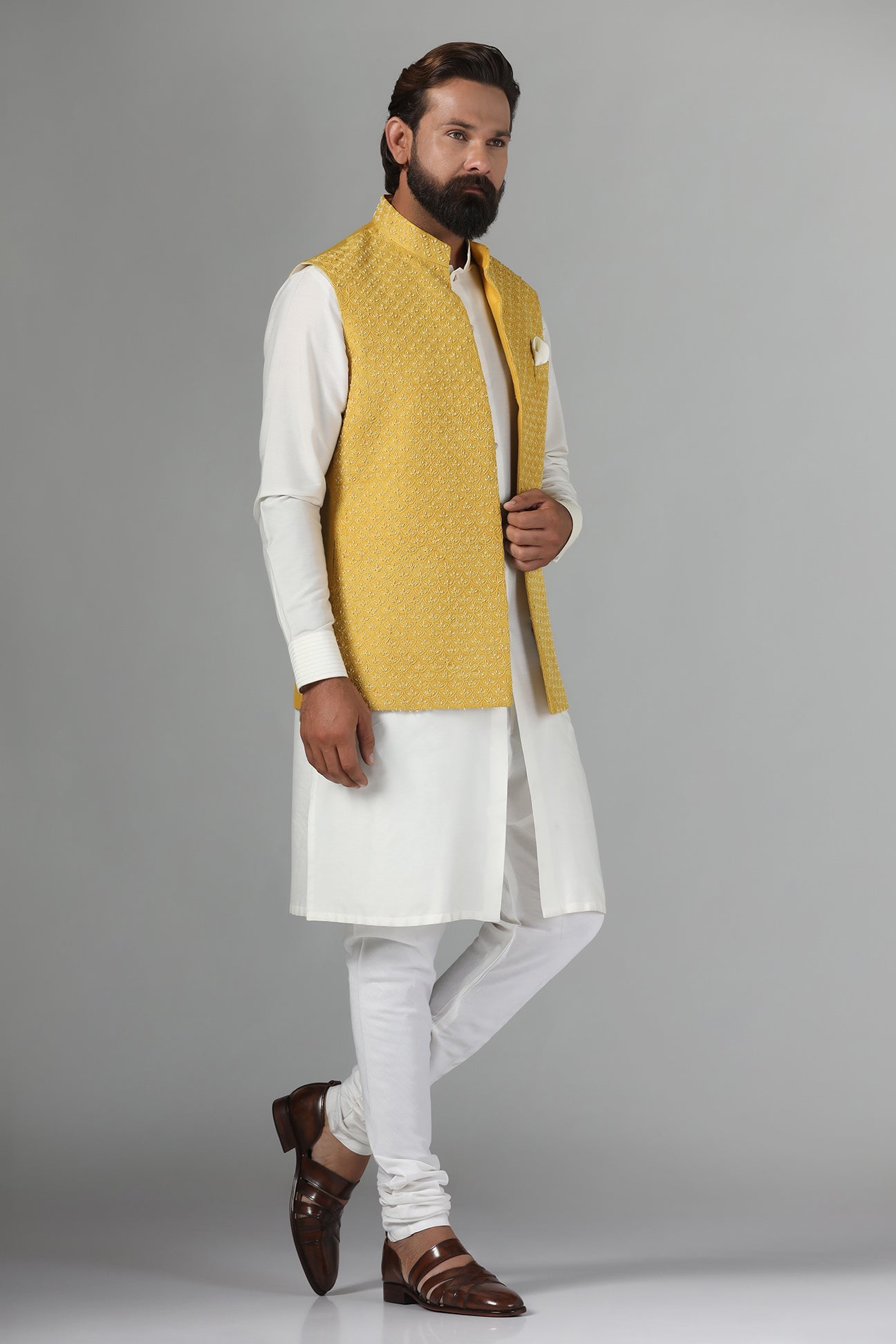 Elevate your style with our Yellow Nehru Jacket, adorned with tonal embroidery. Shop Now!