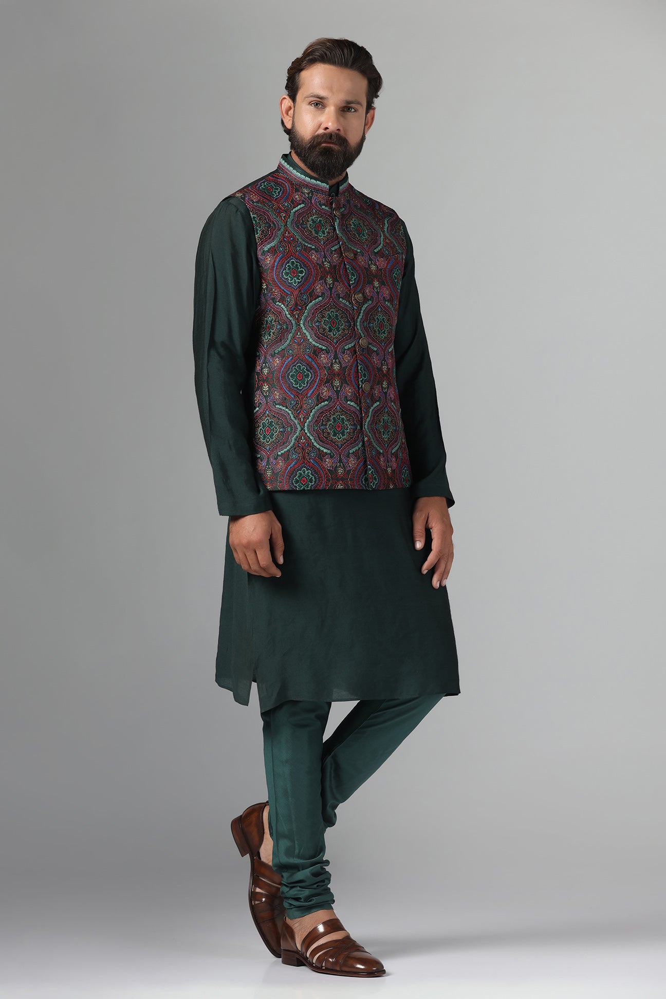 Stand out in style with our Nehru Jacket adorned in vibrant multi-colored embroidery. Shop Now!