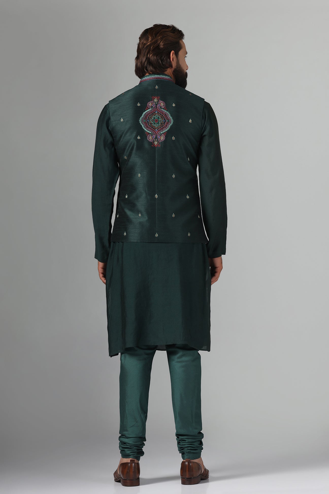 Stand out in style with our Nehru Jacket adorned in vibrant multi-colored embroidery. Shop Now!