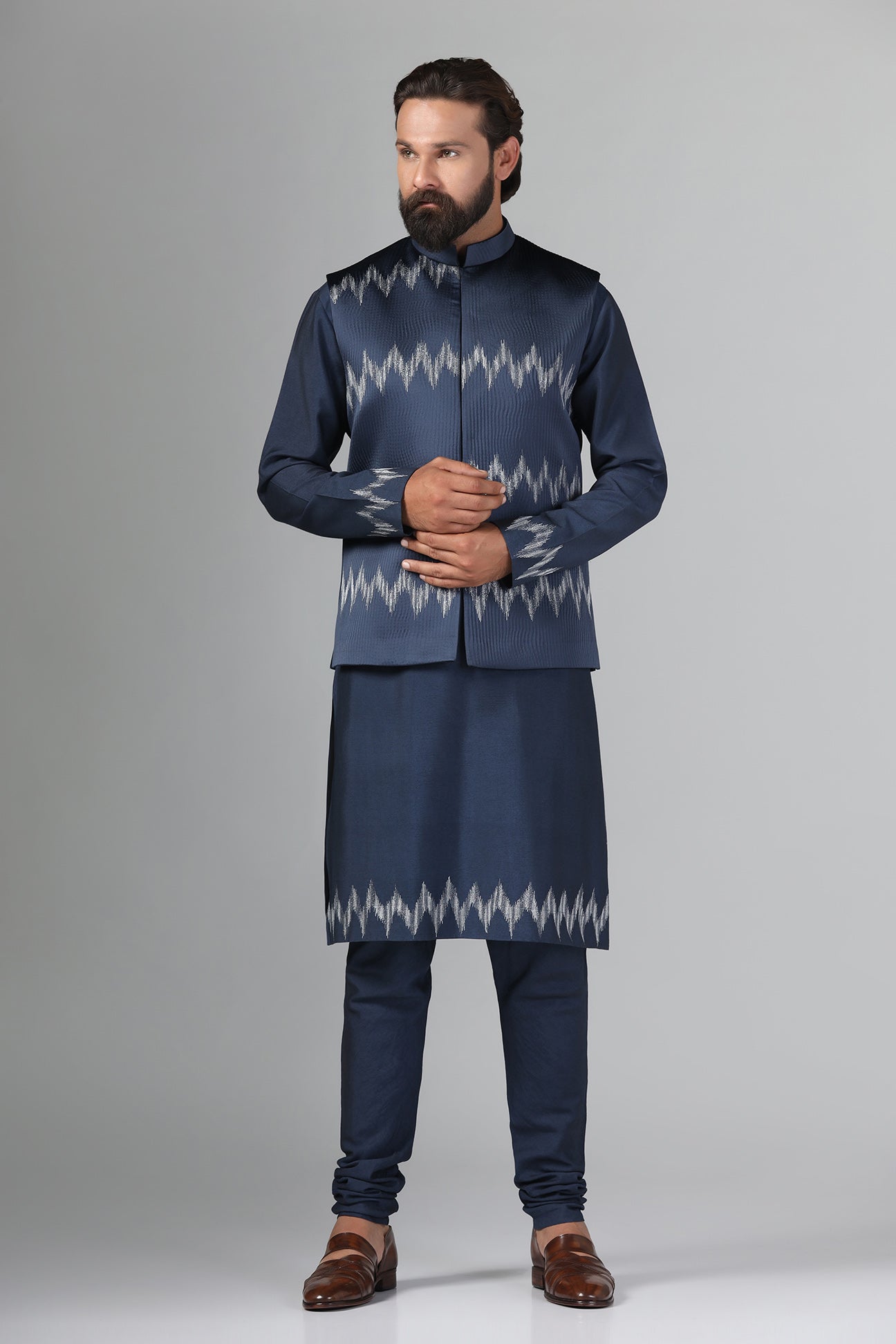 Step up your style with our navy blue Nehru Jacket crafted from textured fabric. Shop Now!