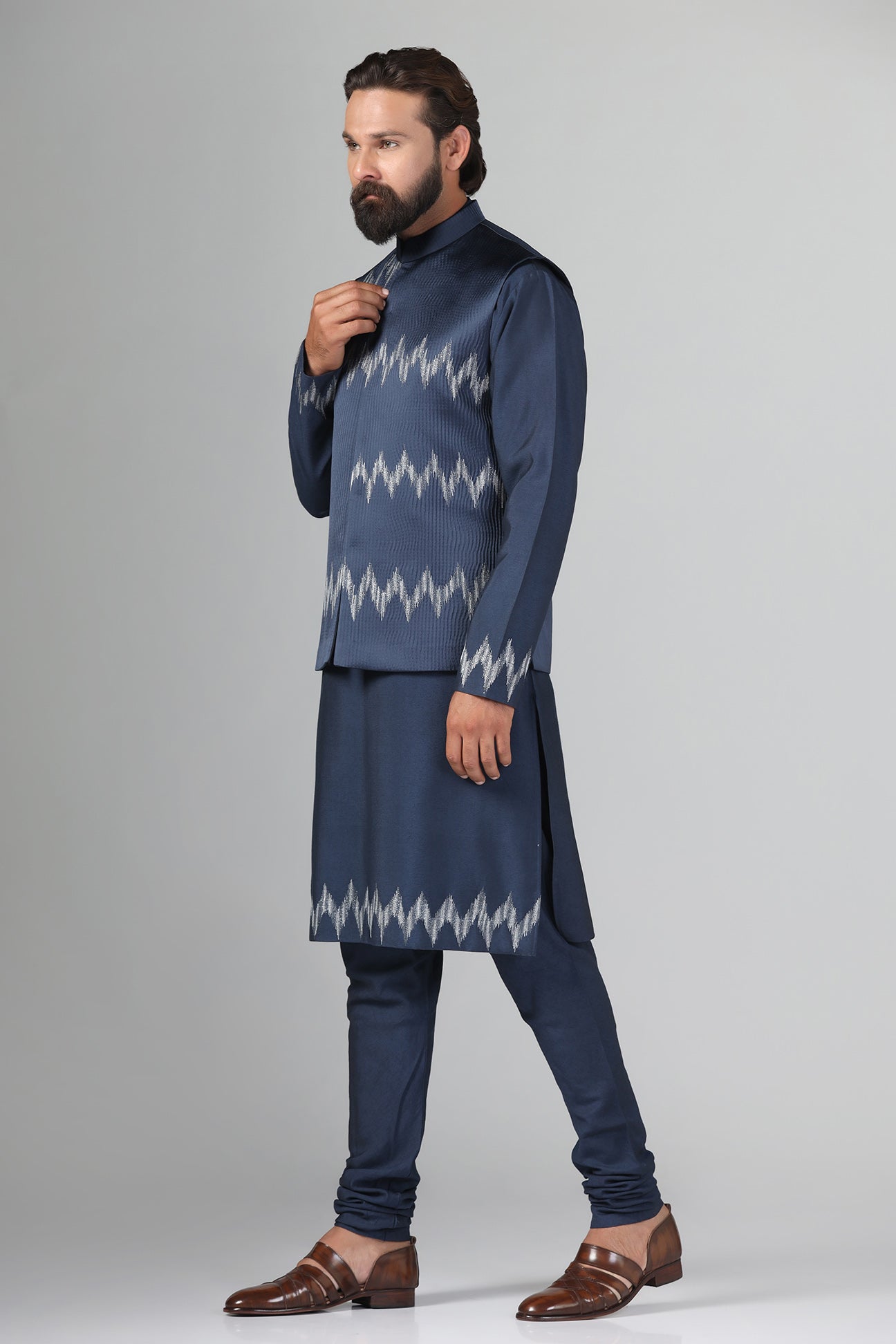 Step up your style with our navy blue Nehru Jacket crafted from textured fabric. Shop Now!