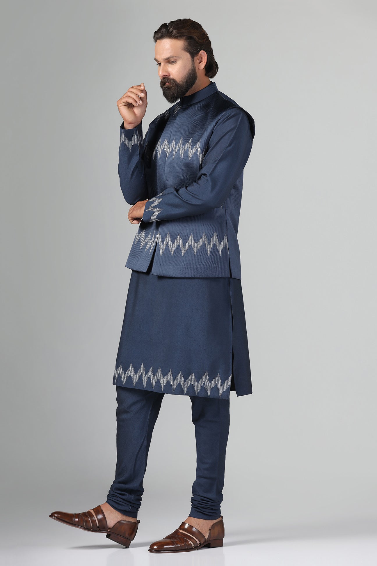 Step up your style with our navy blue Nehru Jacket crafted from textured fabric. Shop Now!
