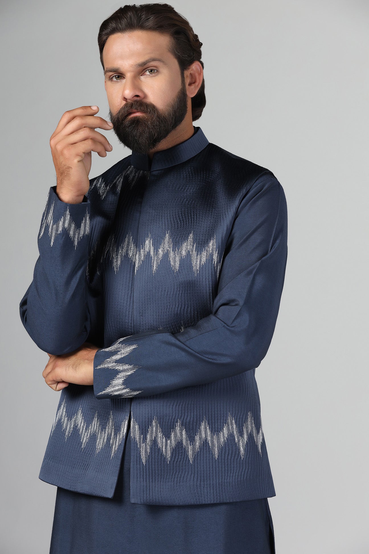 Step up your style with our navy blue Nehru Jacket crafted from textured fabric. Shop Now!
