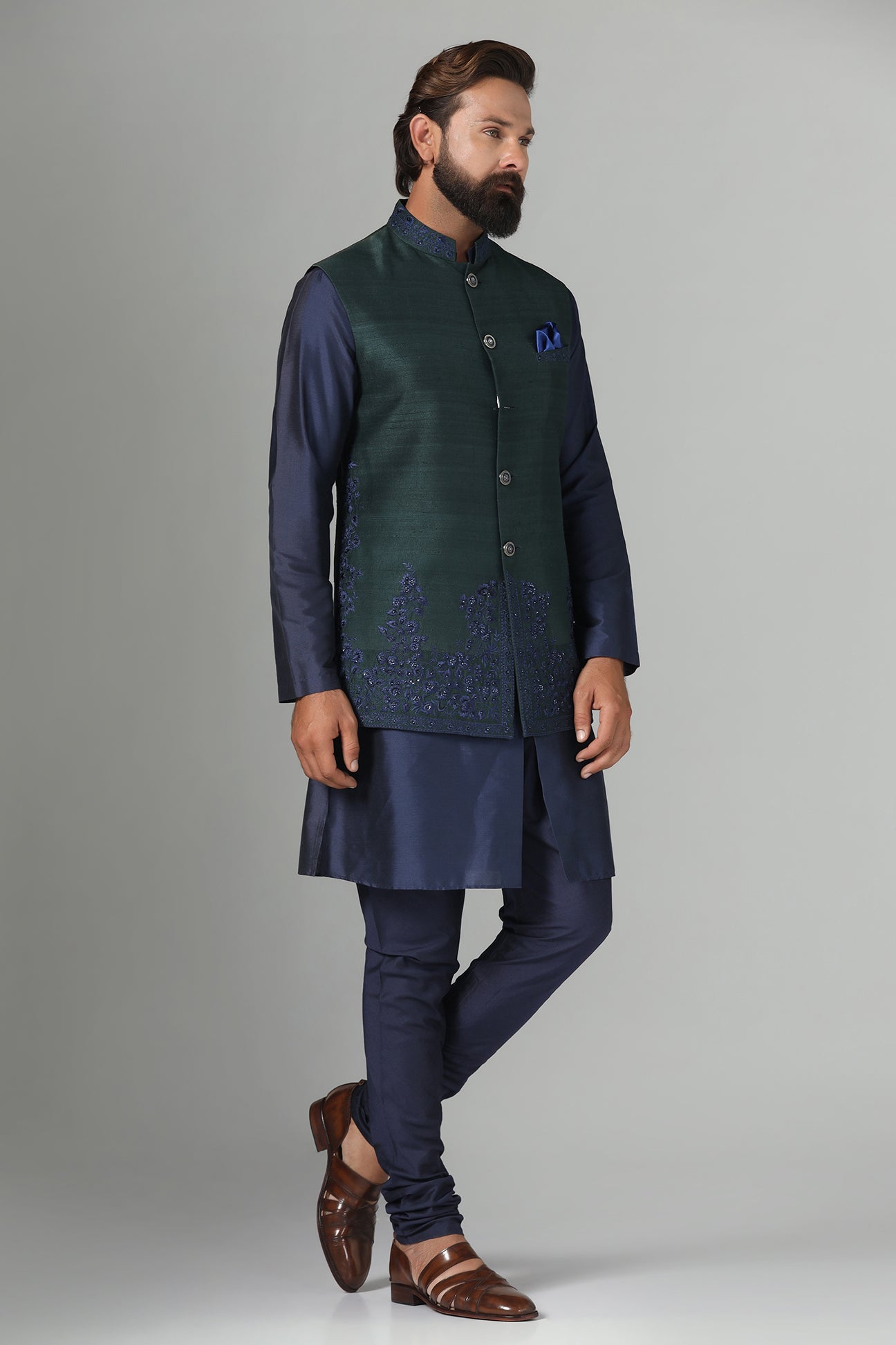Crafted from luxurious raw silk, this green Nehru Jacket exudes sophistication. Shop Now!