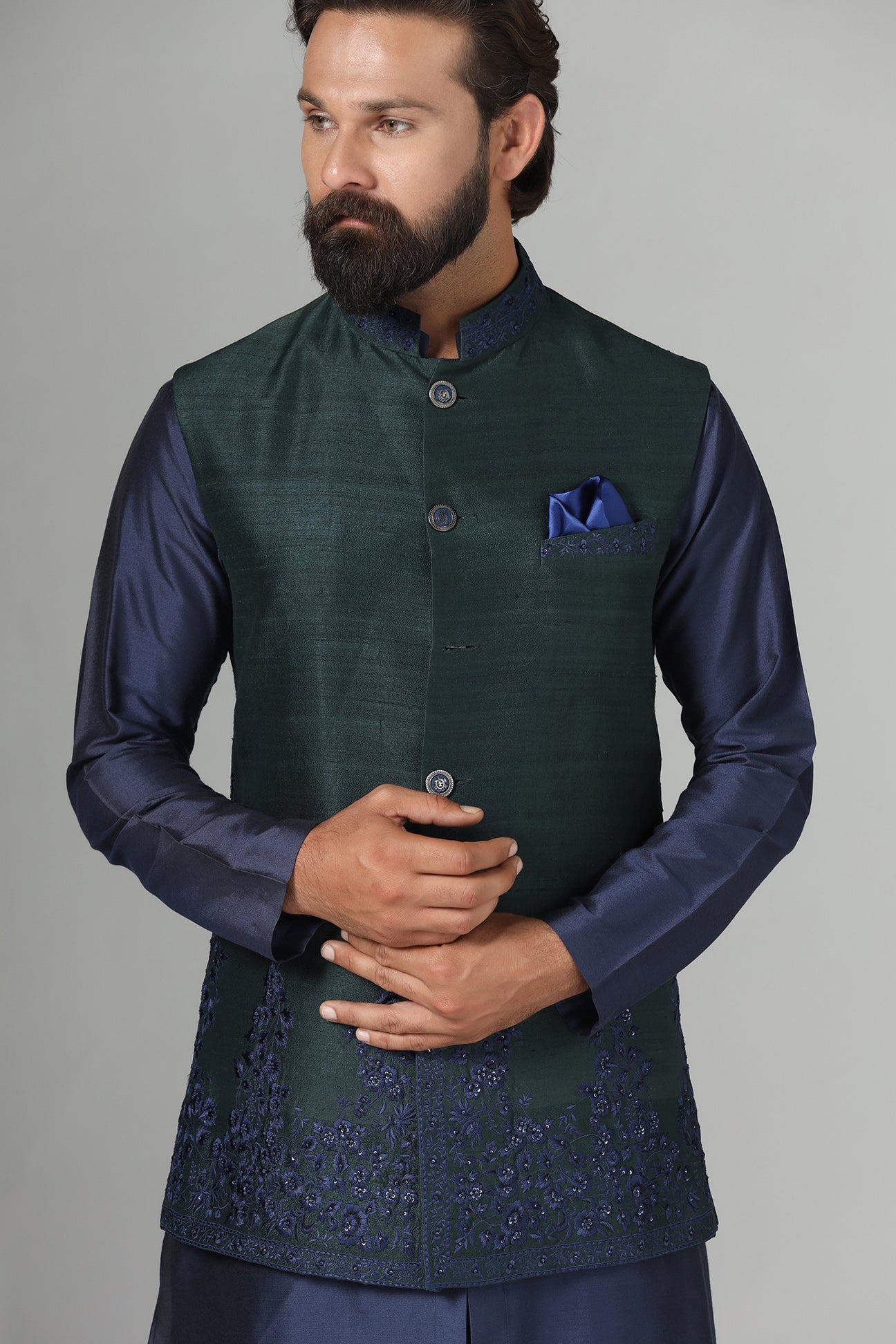Crafted from luxurious raw silk, this green Nehru Jacket exudes sophistication. Shop Now!