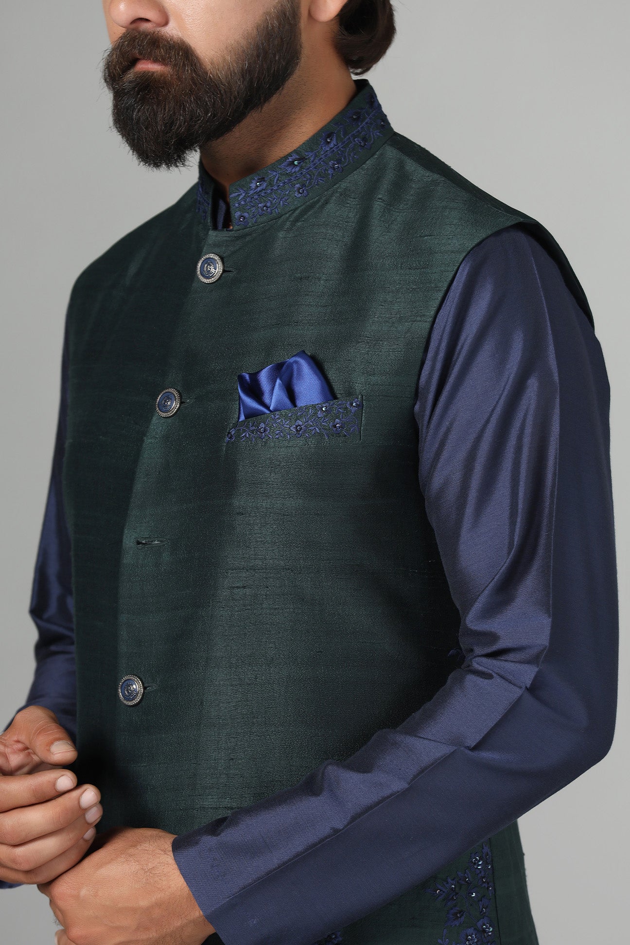 Crafted from luxurious raw silk, this green Nehru Jacket exudes sophistication. Shop Now!