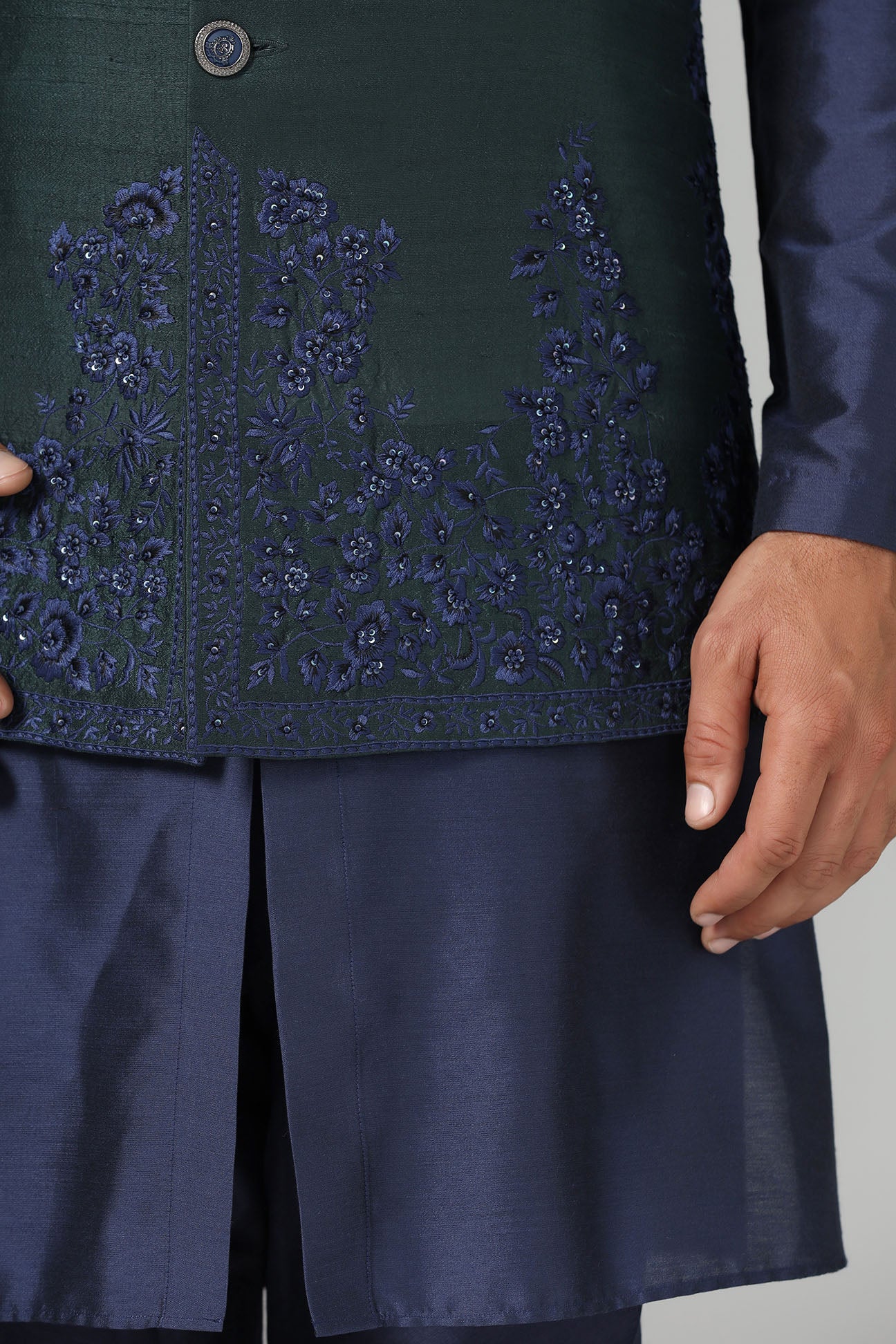 Crafted from luxurious raw silk, this green Nehru Jacket exudes sophistication. Shop Now!