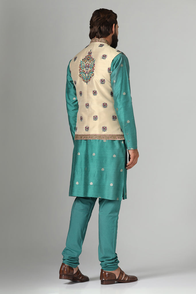 Make a statement with our Nehru jacket, adorned with vibrant multi-color embroidery. Paired with a short kurta and pajama set for effortless style.