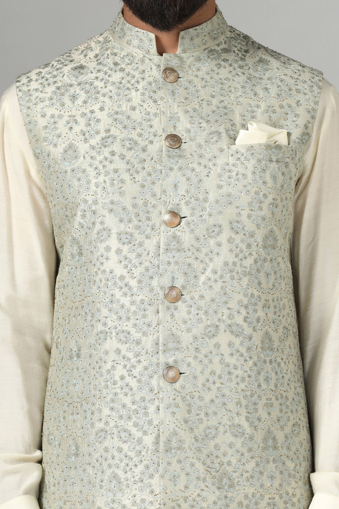 Elevate your look with our Nehru jacket featuring intricate embroidery. Paired effortlessly with a kurta and pajama set for timeless elegance.