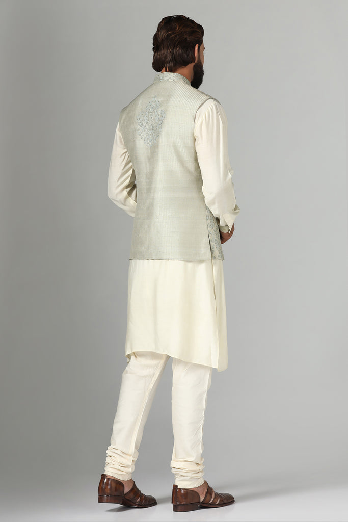 Elevate your look with our Nehru jacket featuring intricate embroidery. Paired effortlessly with a kurta and pajama set for timeless elegance.