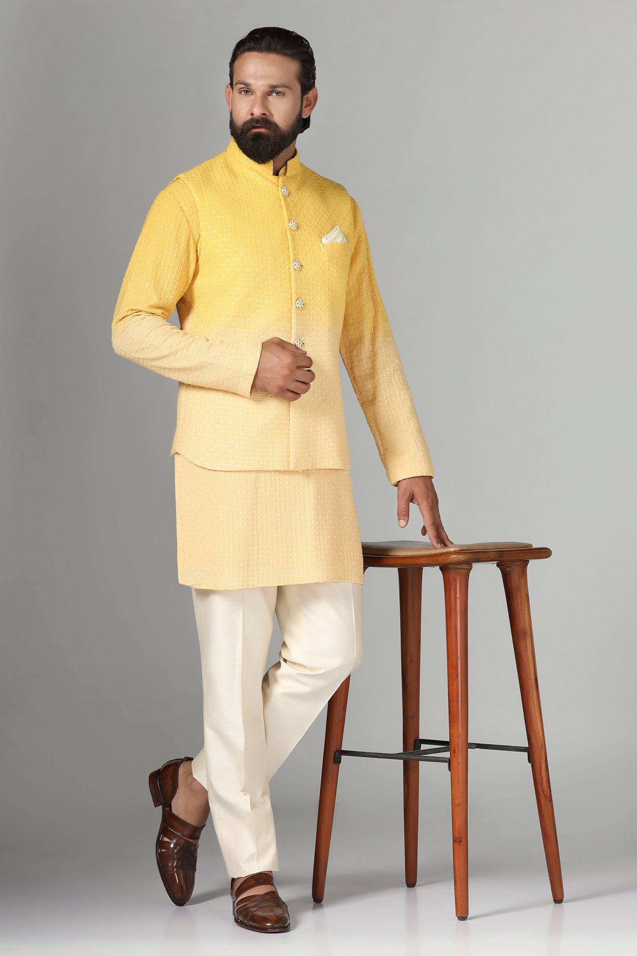Radiate charm in our yellow ombre Nehru jacket, paired with ombre kurta and pajama. Shop Now!