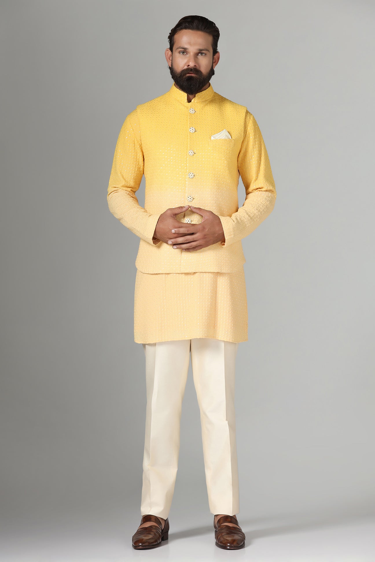Radiate charm in our yellow ombre Nehru jacket, paired with ombre kurta and pajama. Shop Now!