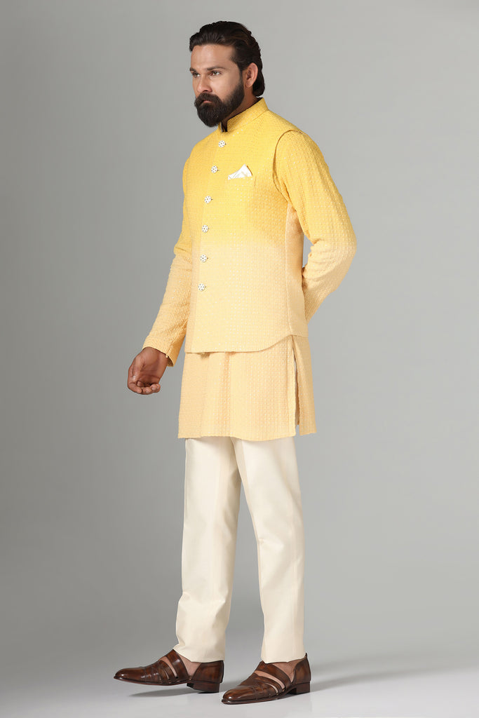 Radiate charm in our yellow ombre Nehru jacket, paired with a short textured ombre kurta and pajama for a vibrant ensemble.