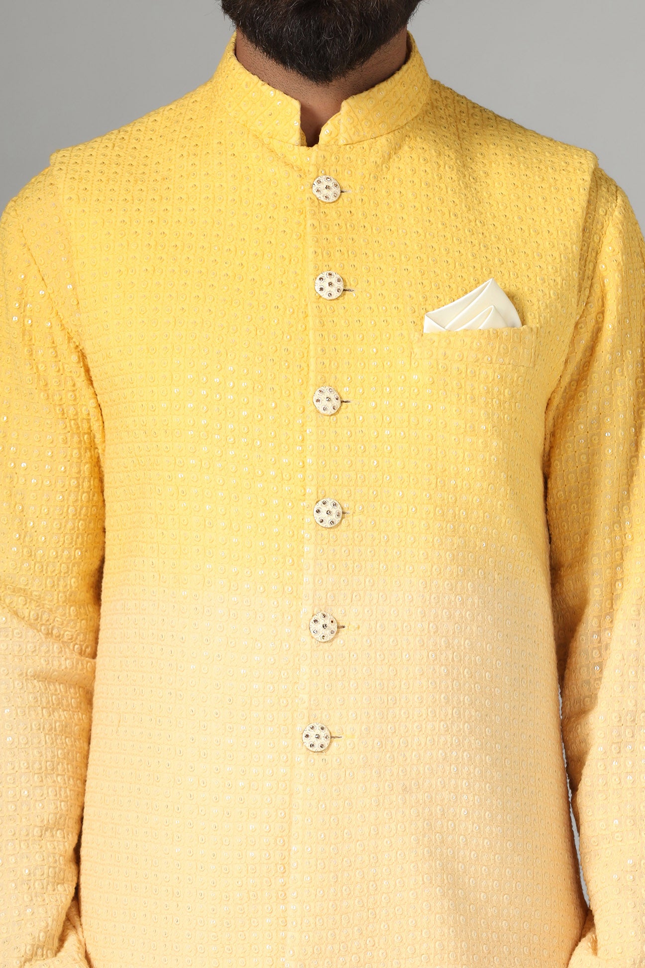 Radiate charm in our yellow ombre Nehru jacket, paired with ombre kurta and pajama. Shop Now!