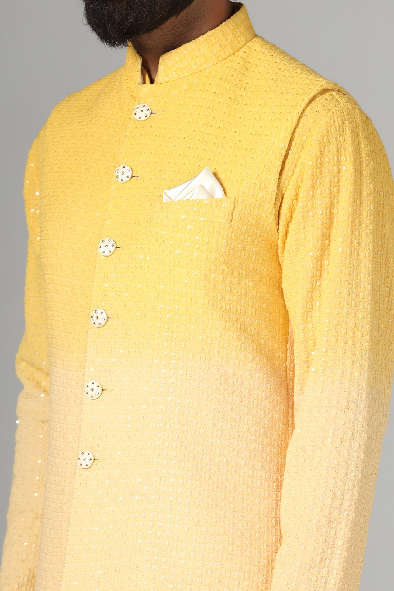 Radiate charm in our yellow ombre Nehru jacket, paired with ombre kurta and pajama. Shop Now!