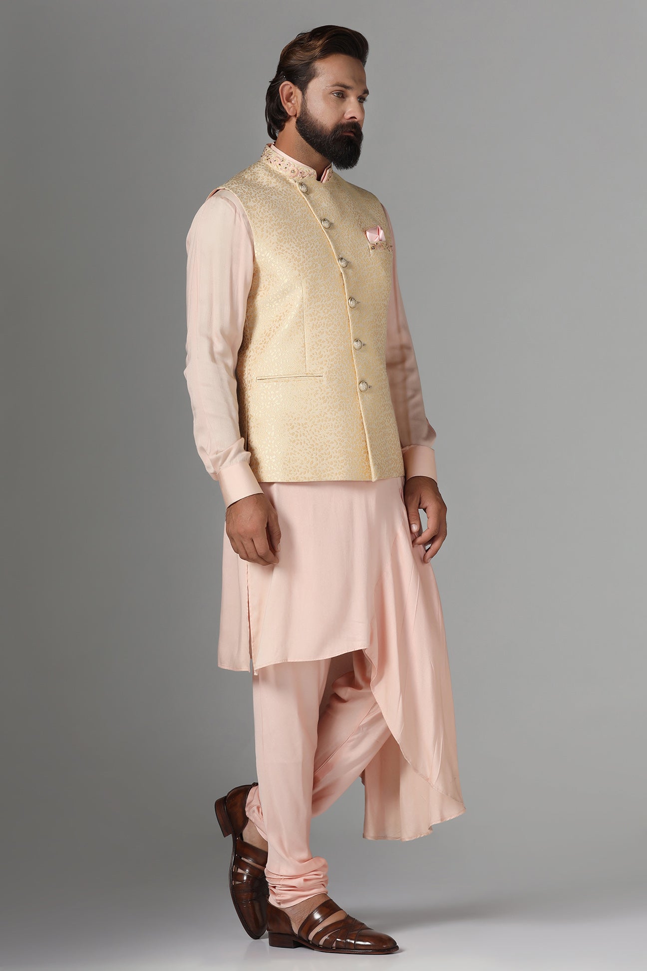 Elevate your ensemble with this exquisite golden jacquard Nehru jacket. Shop Now!