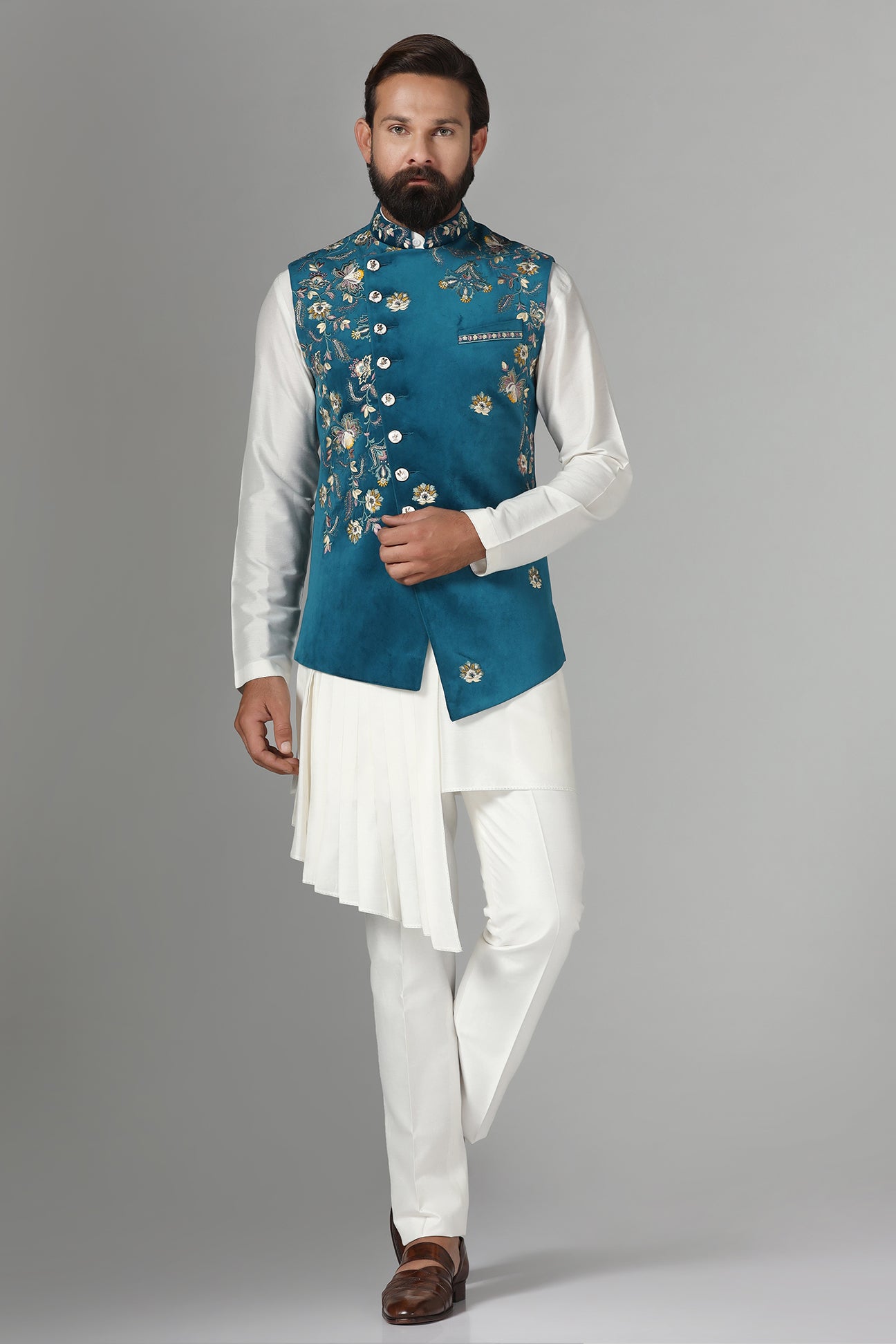 Step into elegance with our velvet Nehru jacket, boasting asymmetric floral embroidery. Shop Now!