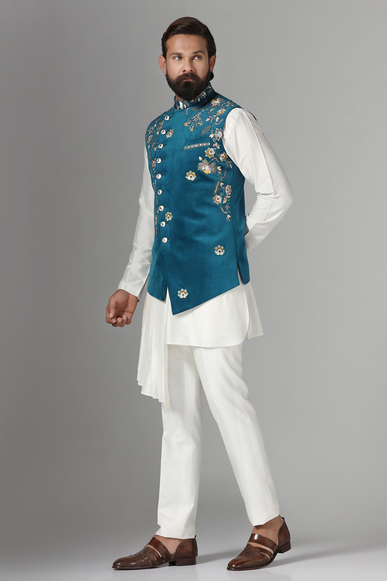 Step into elegance with our velvet Nehru jacket, boasting asymmetric floral embroidery. Shop Now!