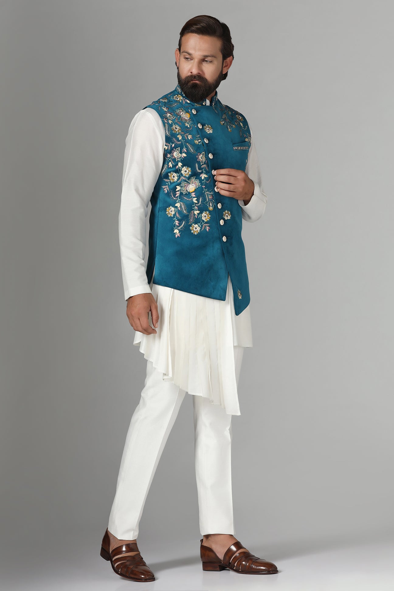 Step into elegance with our velvet Nehru jacket, boasting asymmetric floral embroidery. Shop Now!