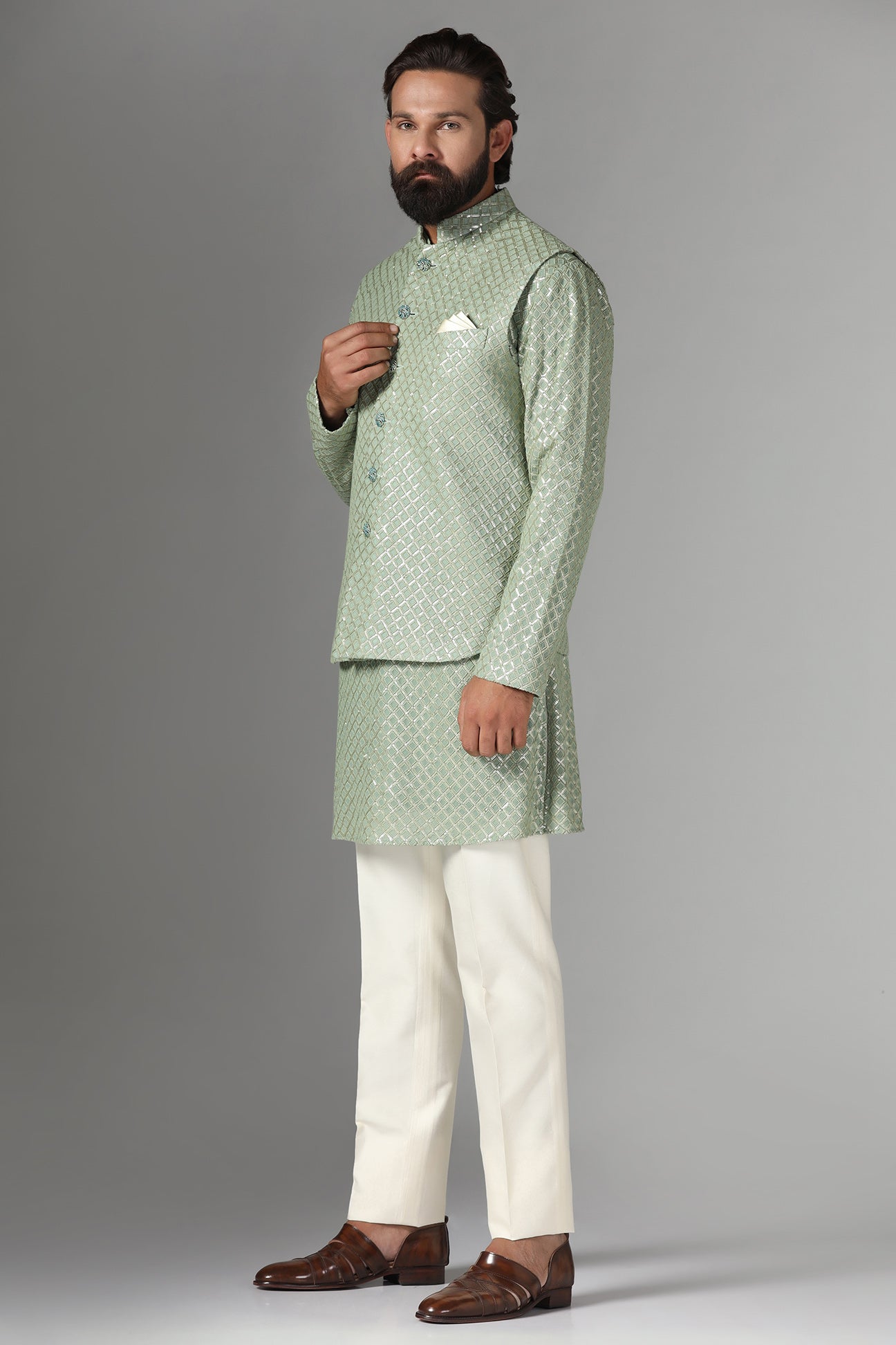 Radiate elegance in our light green Nehru Jacket adorned with sequin embroidery. Shop Now!