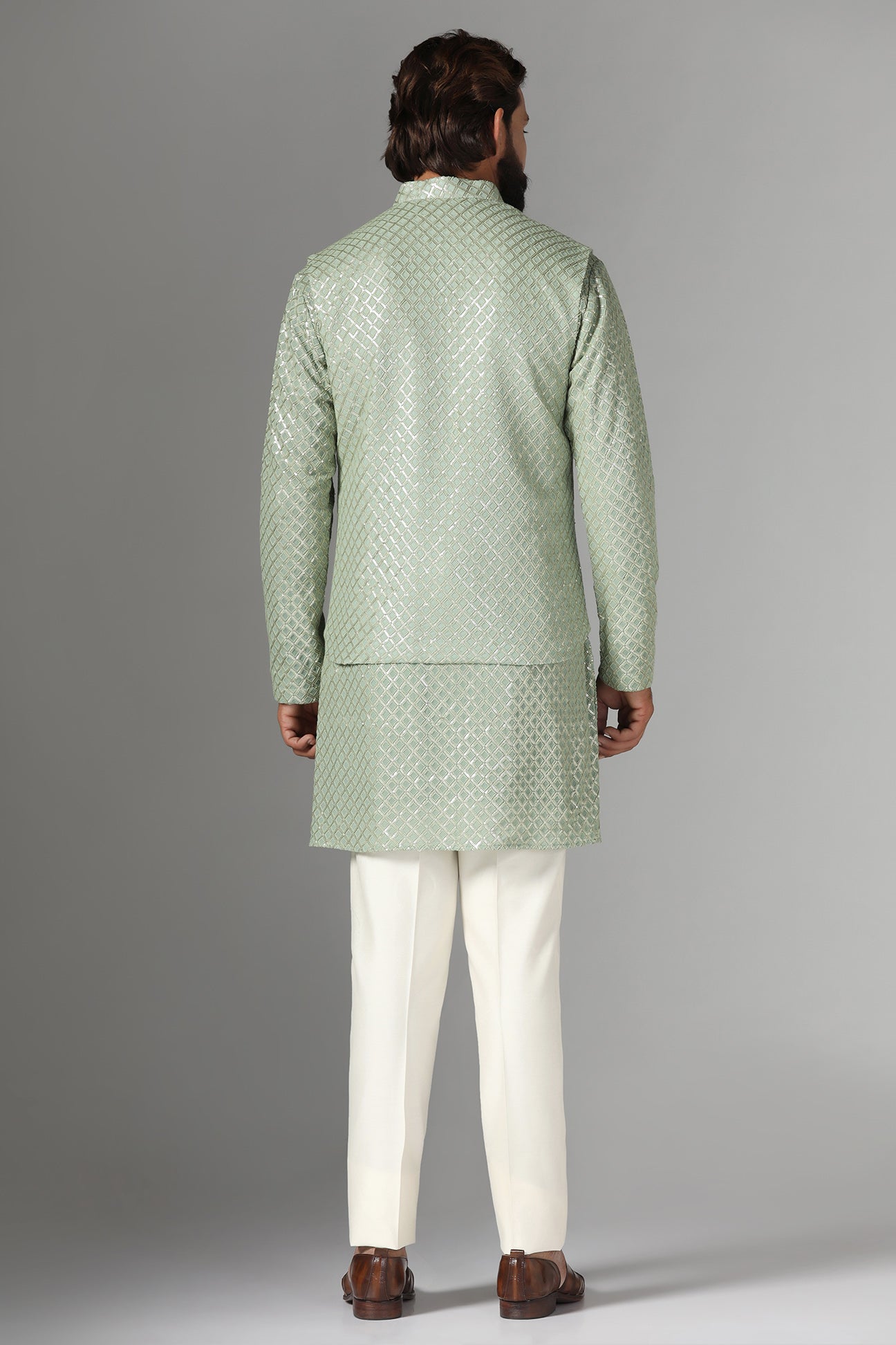Radiate elegance in our light green Nehru Jacket adorned with sequin embroidery. Shop Now!