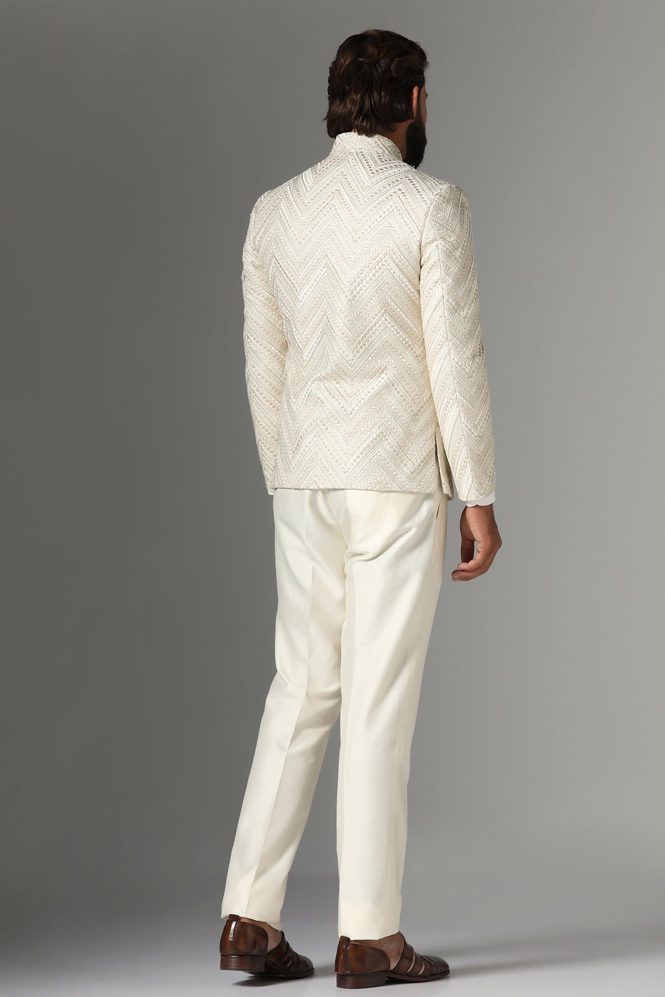 Elevate style with our off-white Bandhgala suit in raw-silk fabric. Shop Now!