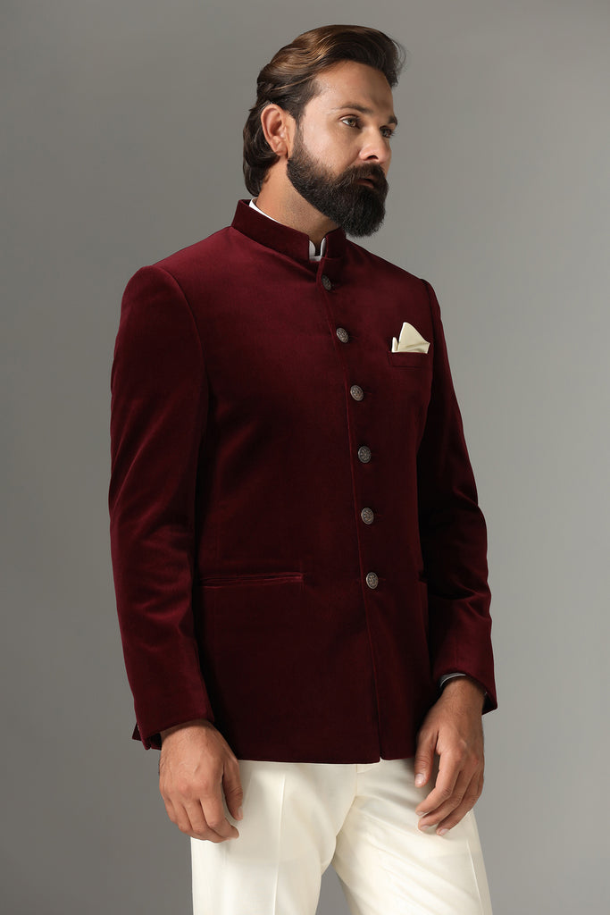 Step into sophistication with our maroon Bandhgala suit in rich velvet fabric. Shop Now!