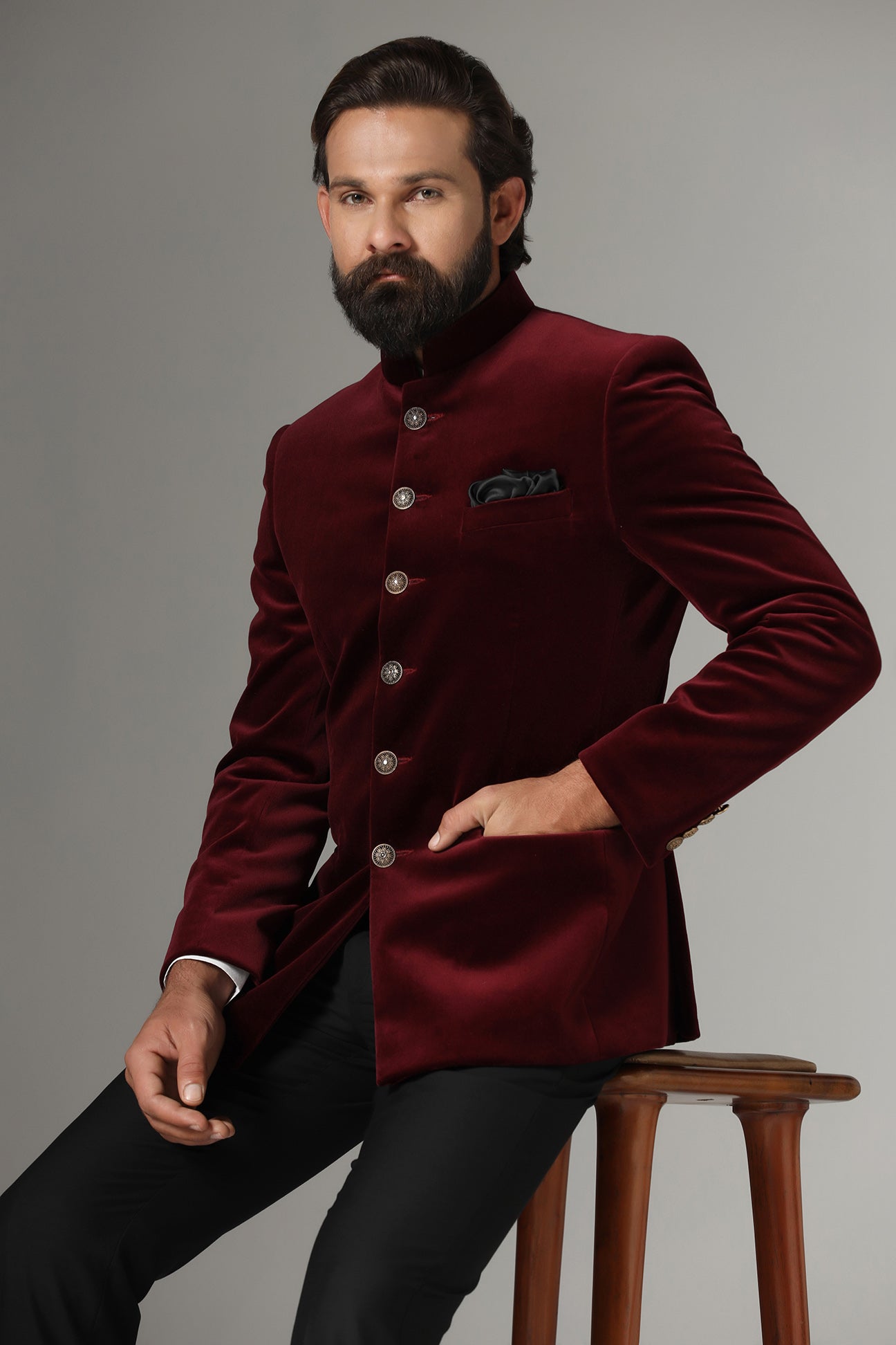 Dress in regal elegance with our Velvet Maroon Bandhgala Suit featuring a contrast closure. Buy Now!