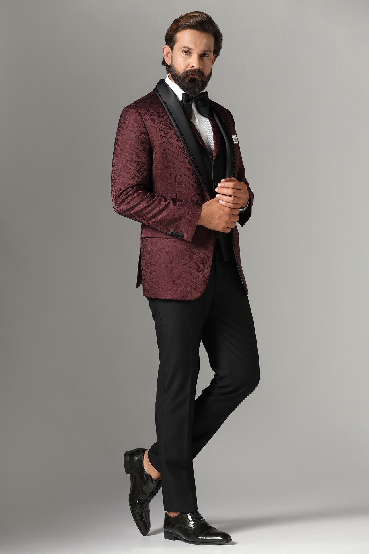 Elevate your style with our Textured Maroon Tuxedo. Shop Now!
