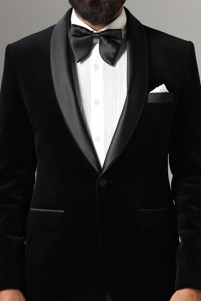 Distinguished elegance in our Black Velvet Tuxedo. Satin shawl collar, paired with Jet-Black trousers for a refined and sophisticated look.