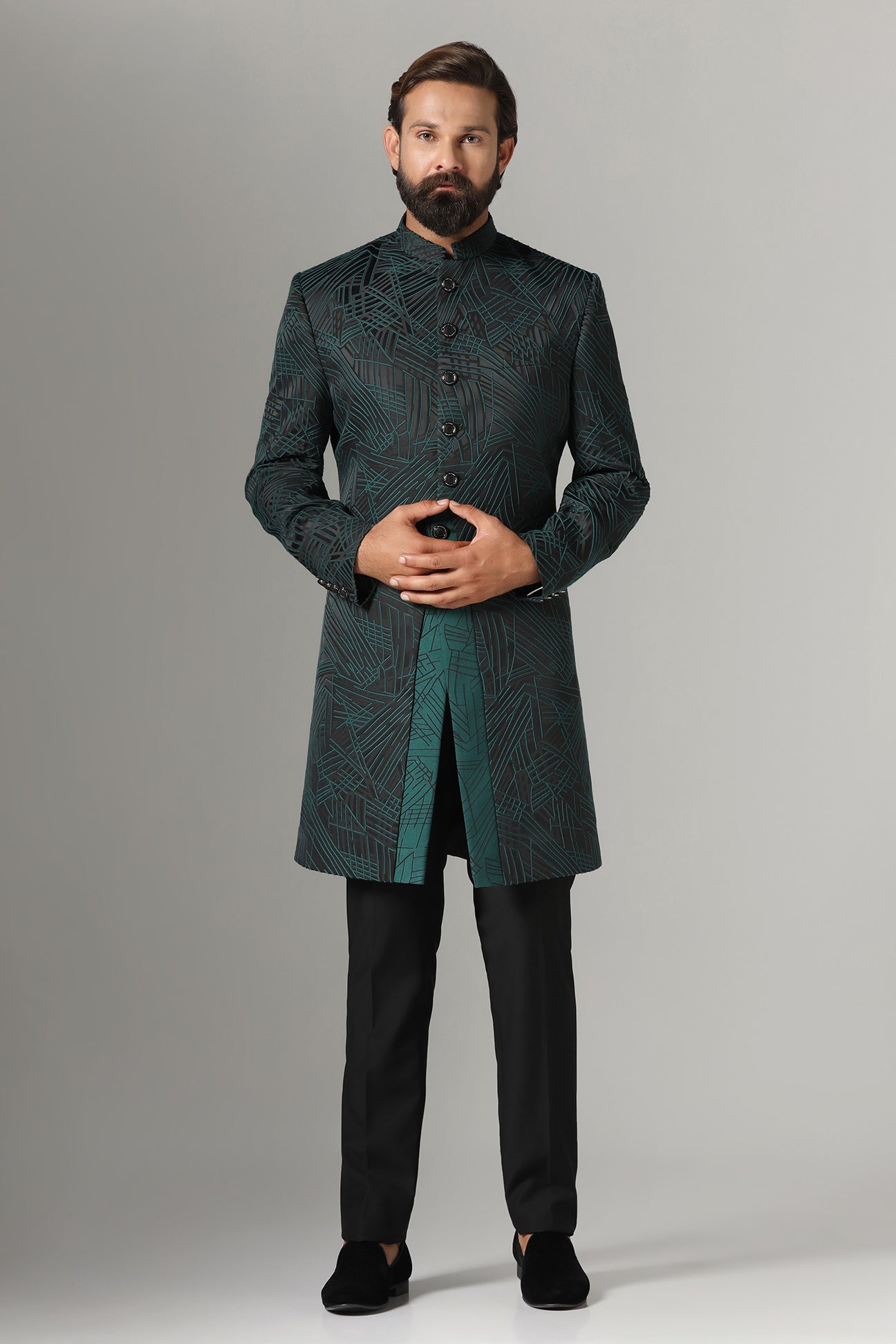 This black Indowestern is highlighted with green line embroidery all across the garment. Shop Now!